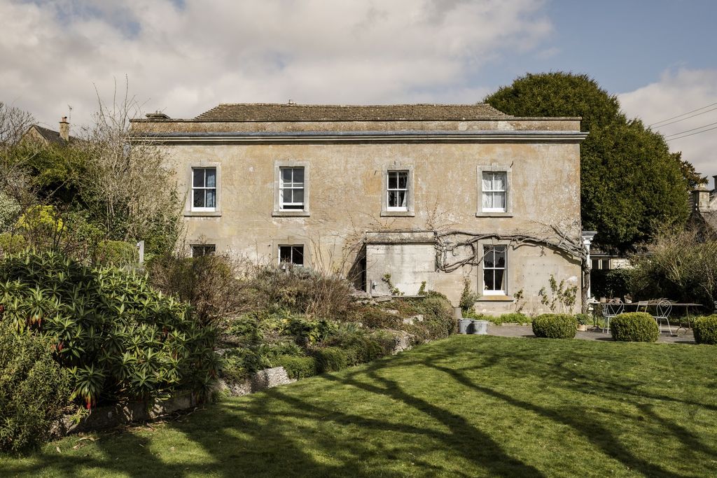 Image may contain Architecture Building Housing House Manor Grass Plant Villa and Cottage