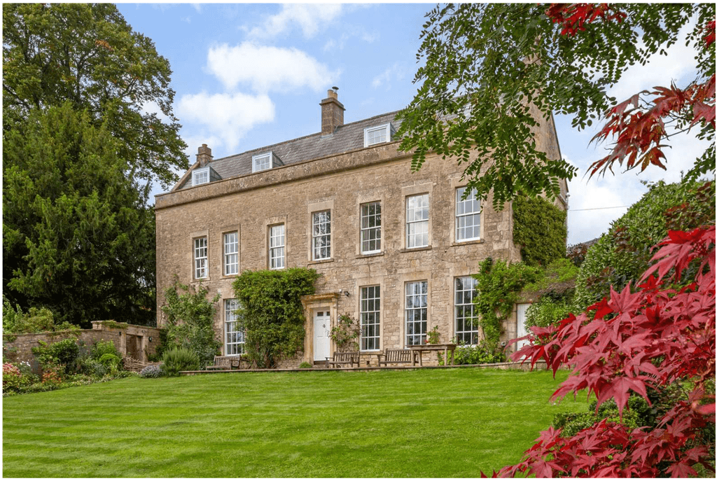 Image may contain Architecture Building Housing House Manor Grass Plant and Tree