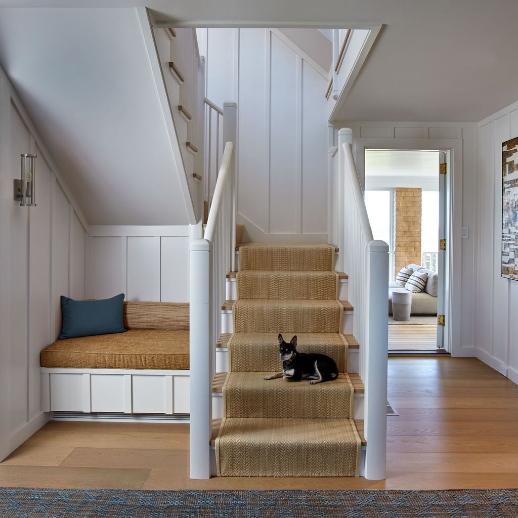 Image may contain Architecture Building House Housing Staircase Indoors Interior Design Animal Canine and Dog