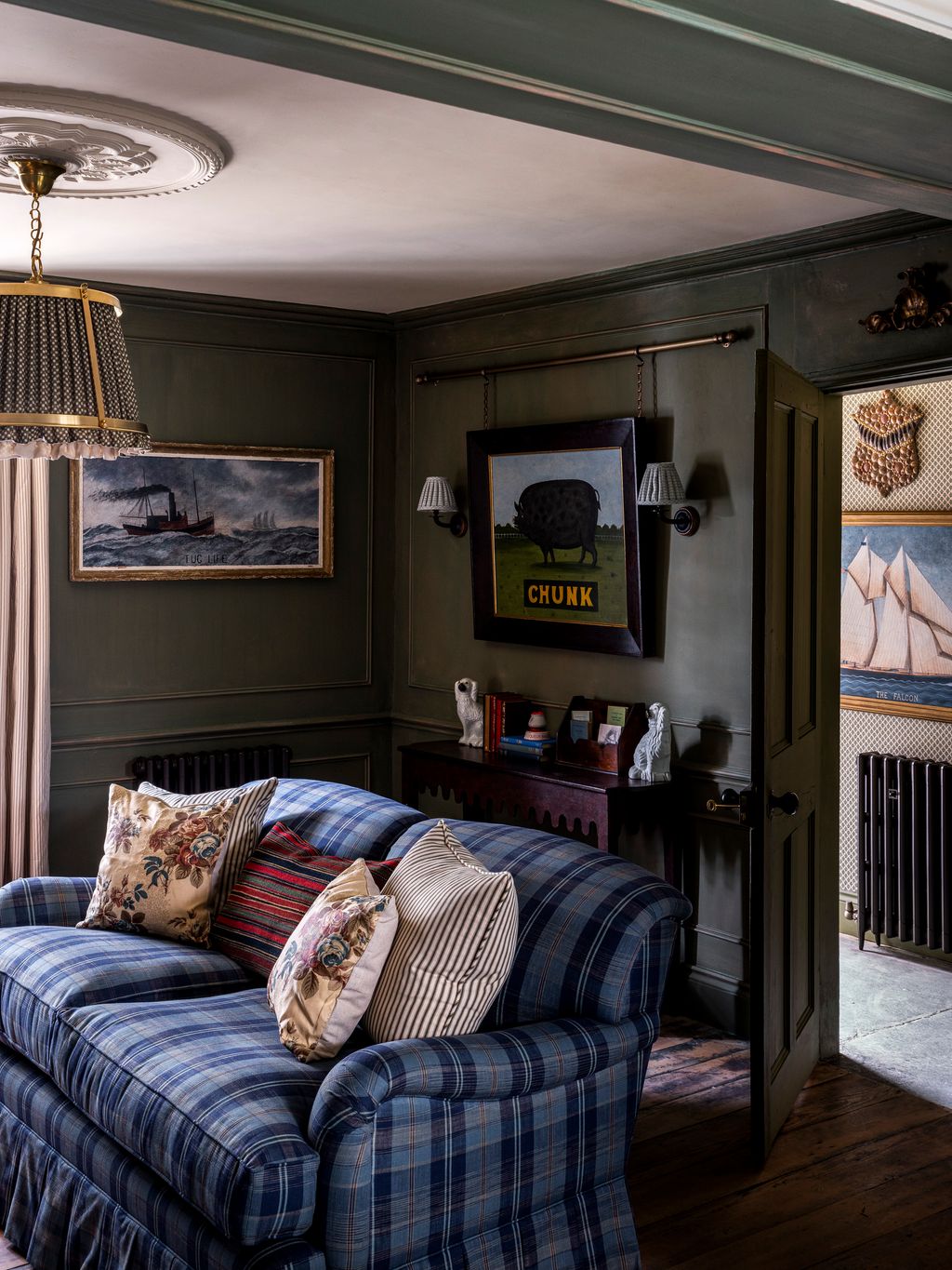 Image may contain Indoors Interior Design Cushion Home Decor Couch Furniture Lamp Architecture and Building