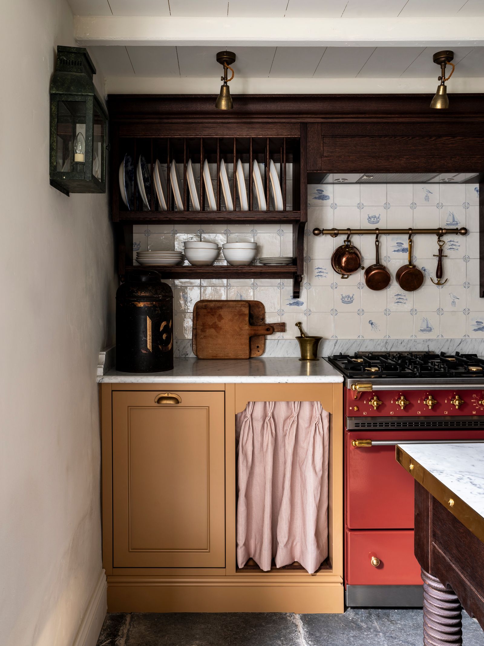 Image may contain Indoors Interior Design Cooktop Kitchen and Lamp