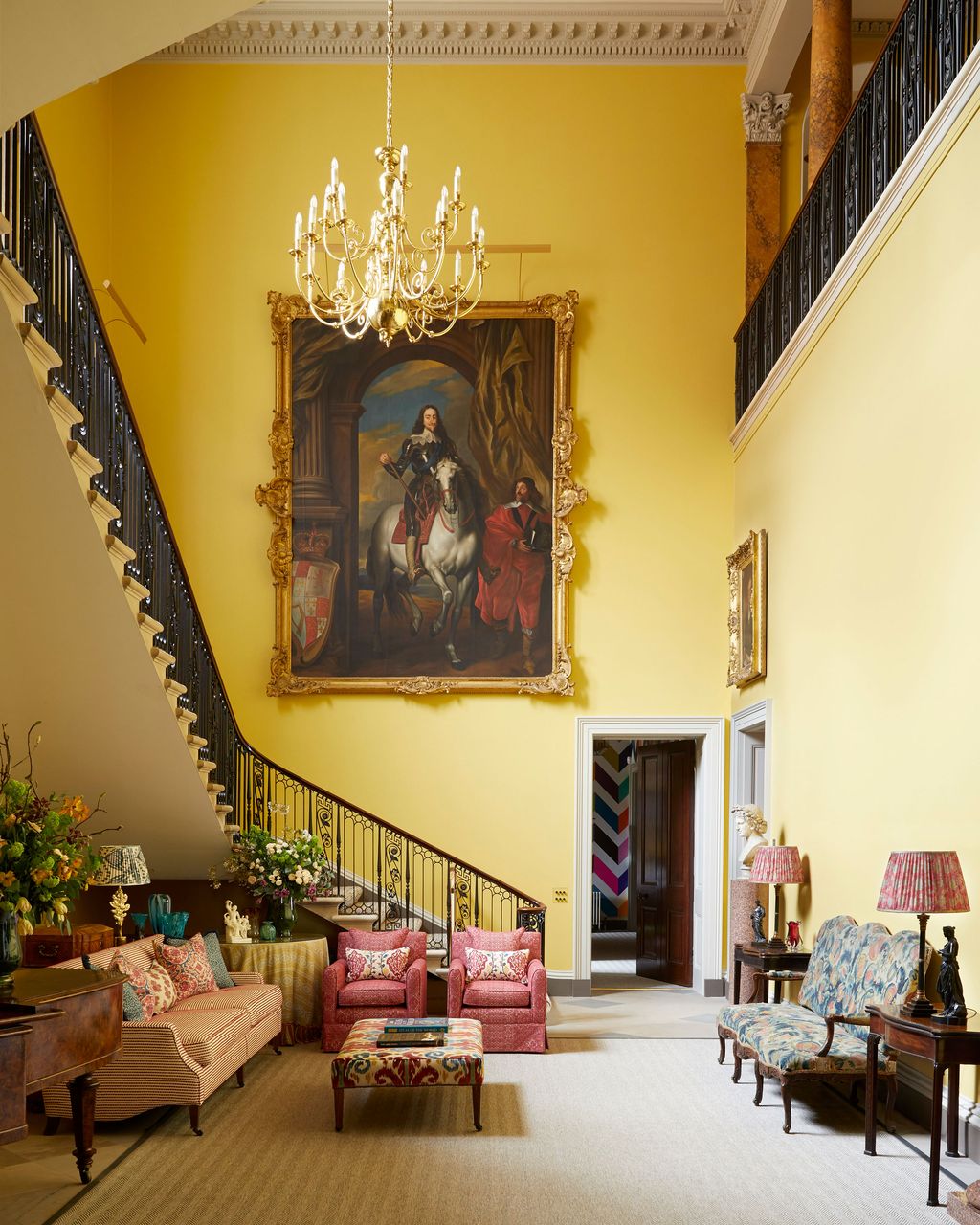 Image may contain Lamp Architecture Building Furniture Indoors Living Room Room Art Painting Desk Table and Chair