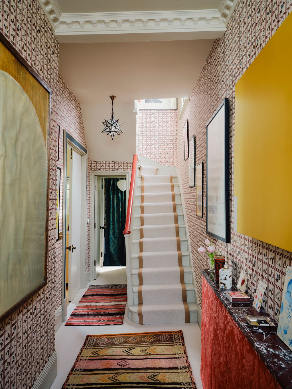 Image may contain Indoors Architecture Building Foyer Home Decor Rug Lamp Art Painting and Interior Design