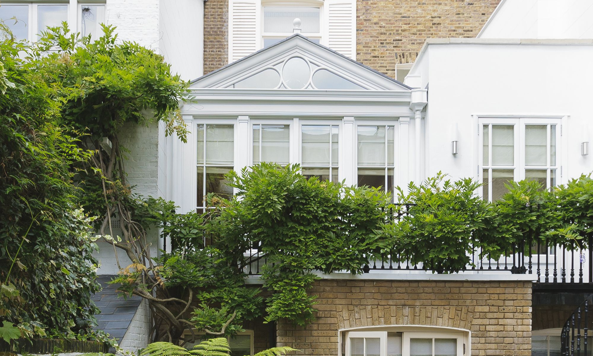 Image may contain: Architecture, Building, Housing, House, Window, and Portico