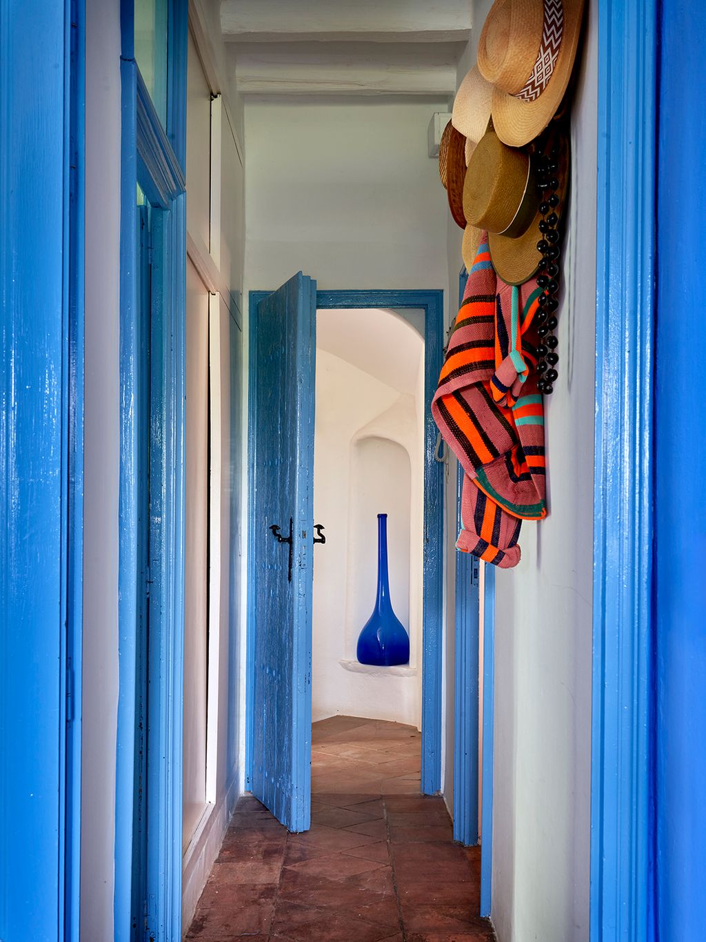 Image may contain Floor Indoors Interior Design Hallway Clothing Hat and Flooring