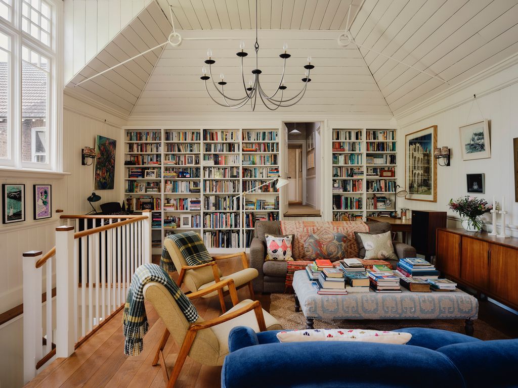 Image may contain Chair Furniture Couch Home Decor Lamp Architecture Building Indoors Living Room Room and Art