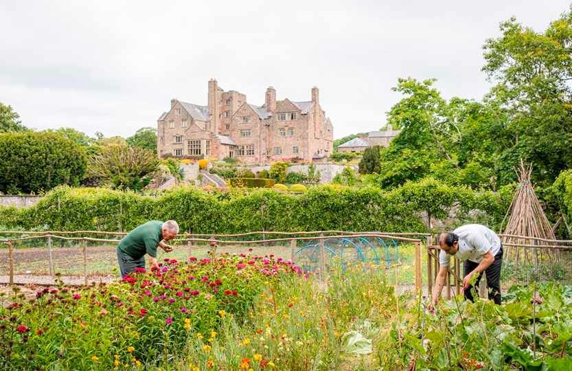 Image may contain Garden Nature Outdoors Adult Person Gardening Architecture Building Housing House and Manor