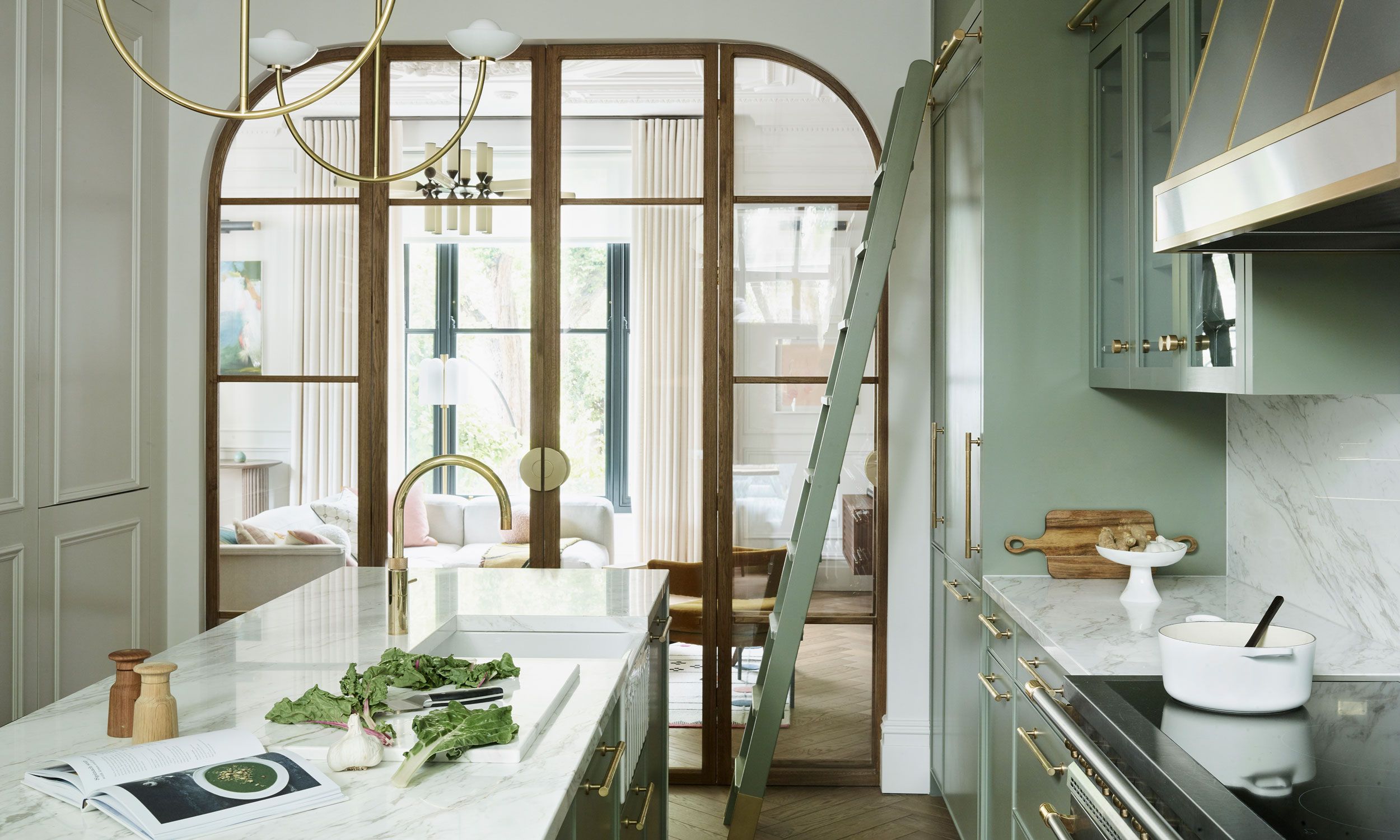 Image may contain: Indoors, Interior Design, Book, Publication, Door, Kitchen, Architecture, Building, Housing, and Chair