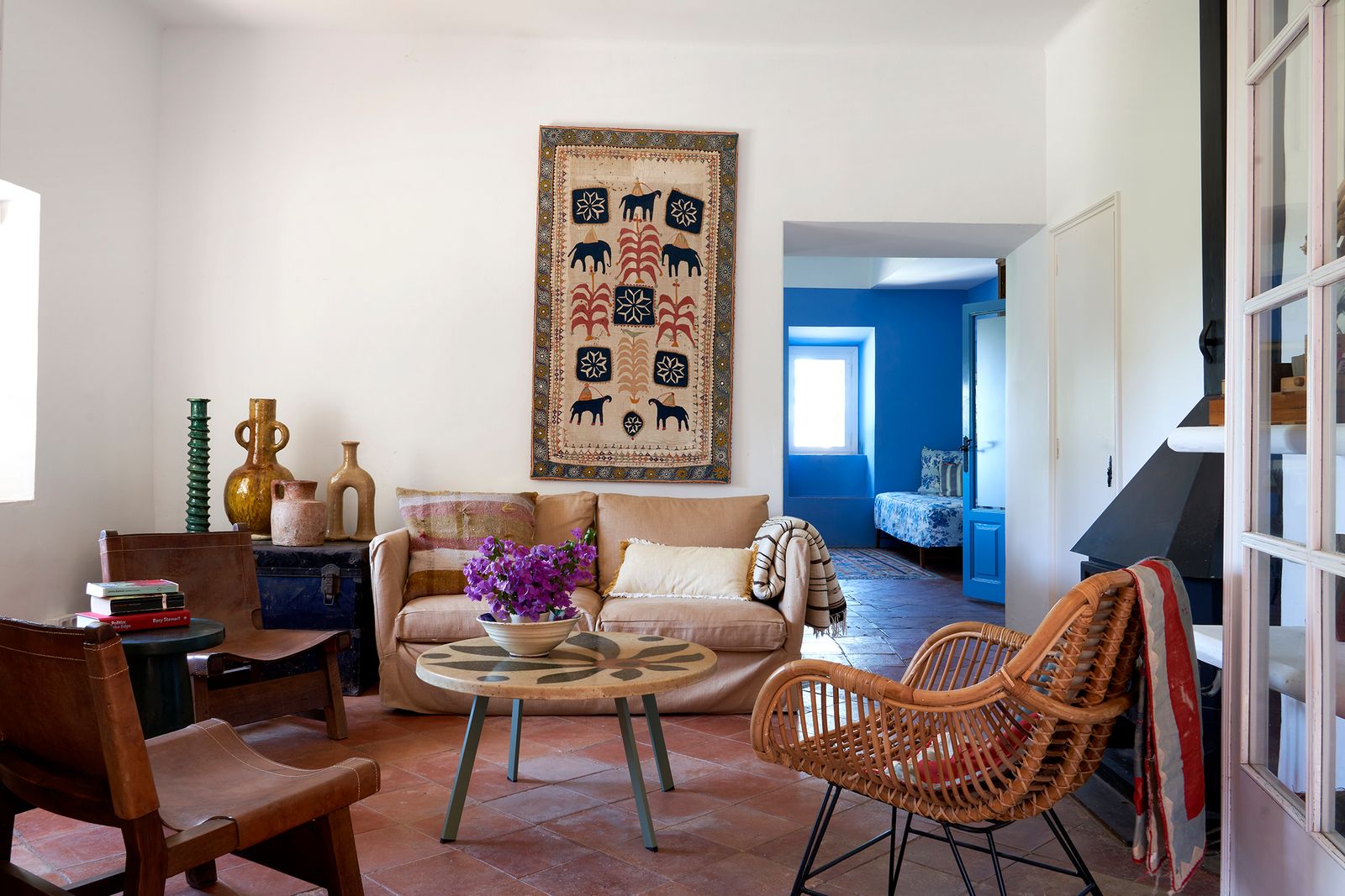 Image may contain Home Decor Rug Chair Furniture Couch Architecture Building Indoors Living Room Room and Table