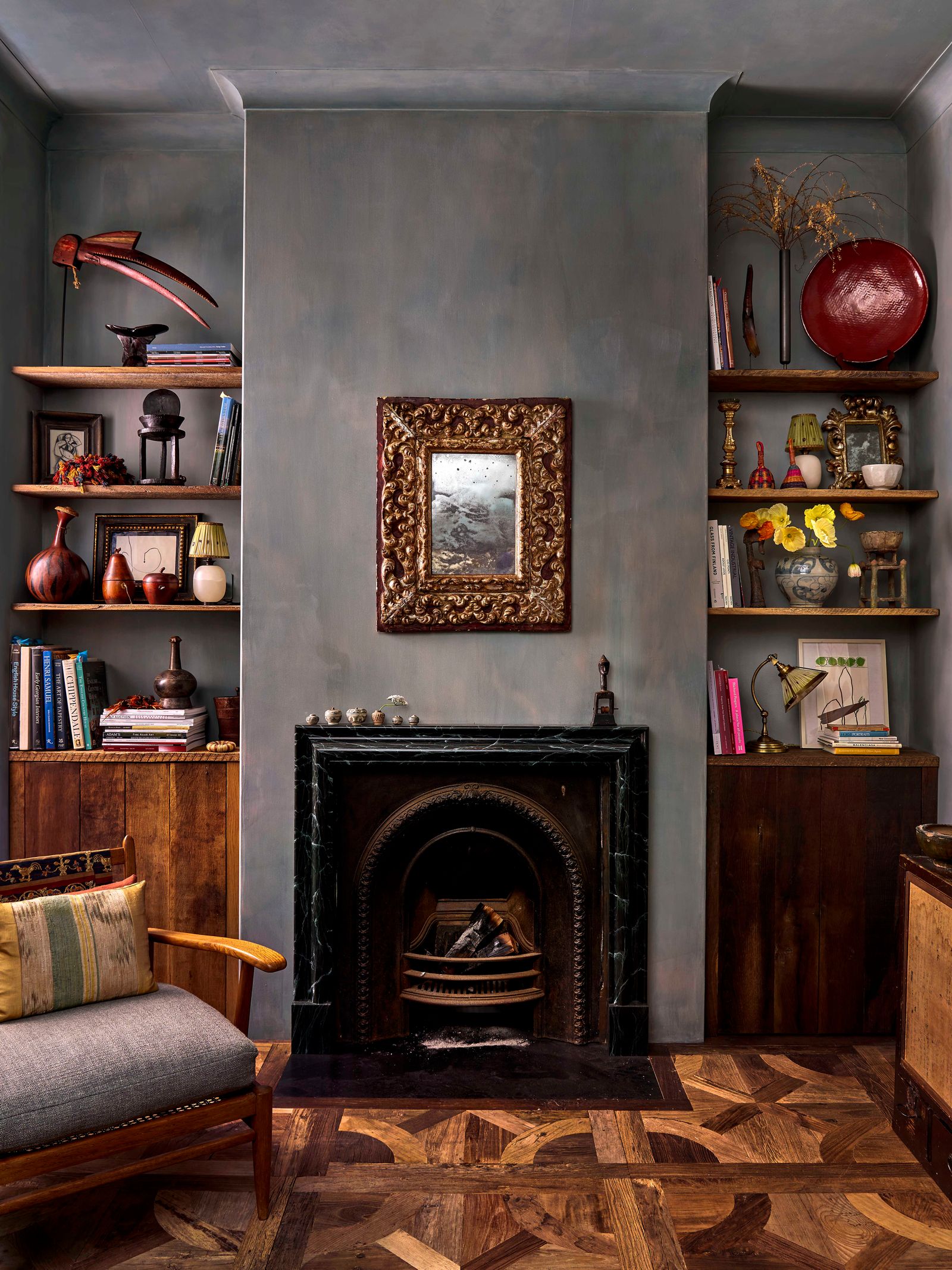 Image may contain Ken Stabler Indoors Interior Design Lamp Fireplace Chair Furniture Art Painting Wood and Hearth