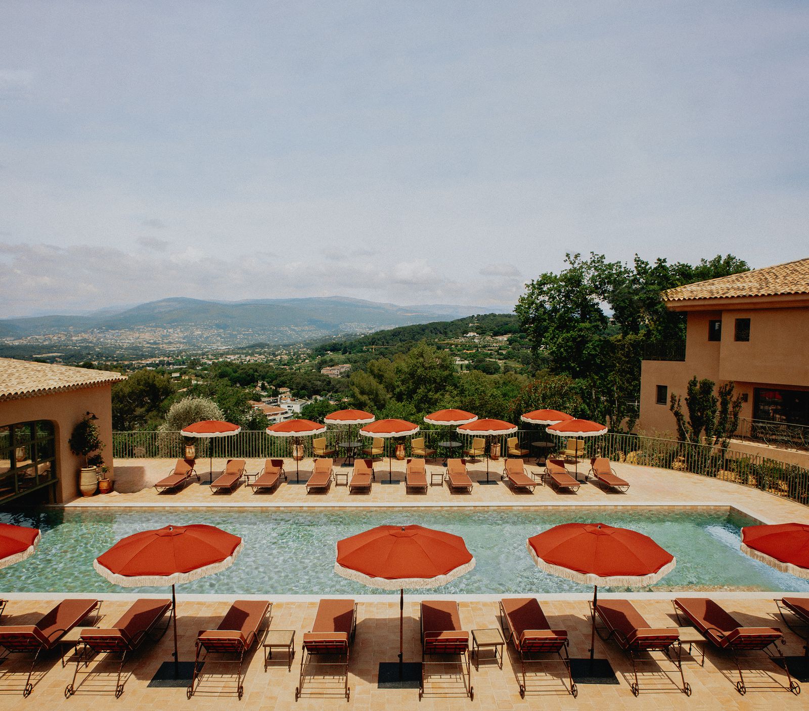 Image may contain Architecture Building House Housing Villa Hotel Resort Plant Chair Furniture Pool and Water