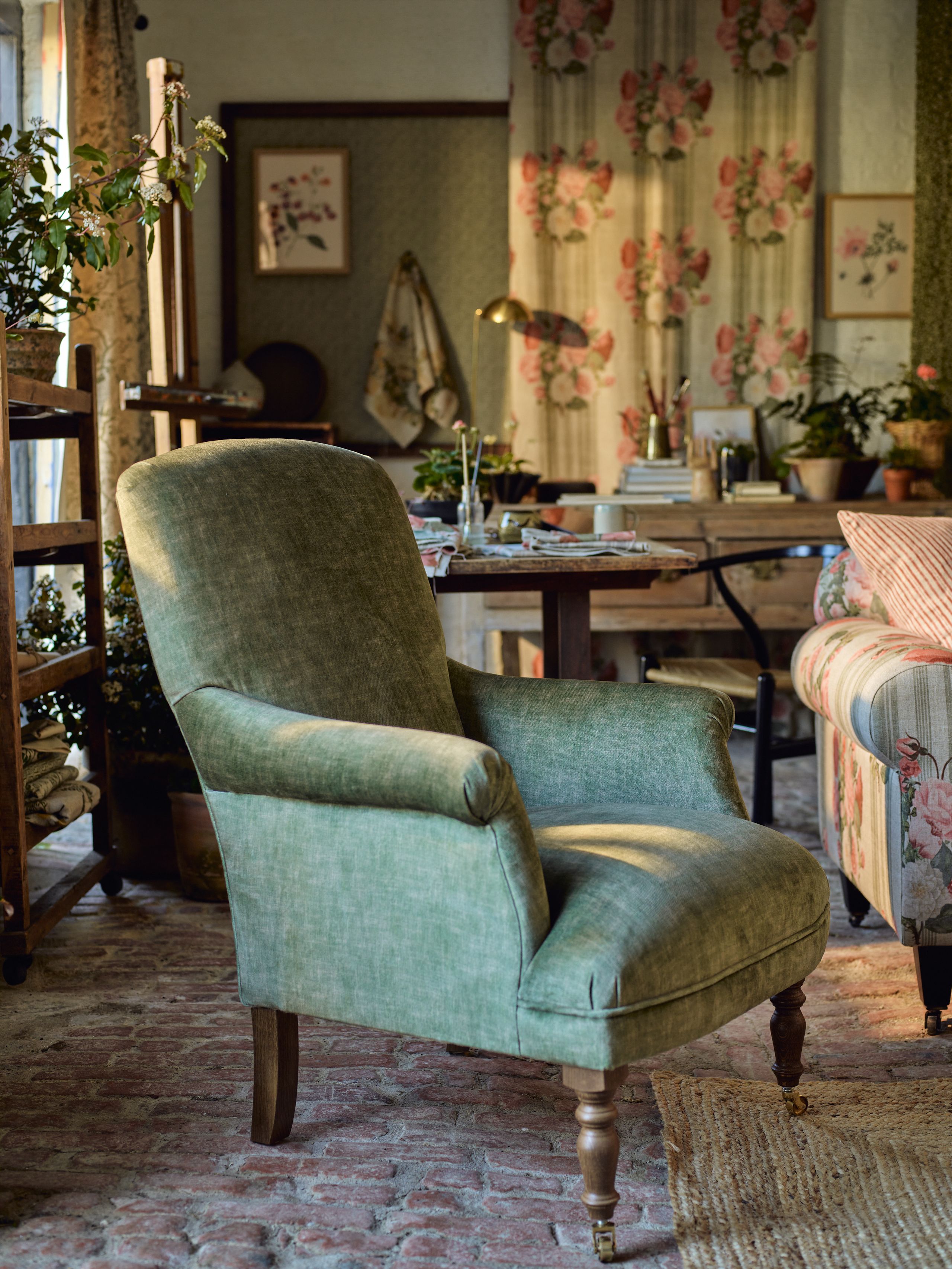 Image may contain: Furniture, Chair, Plant, Art, Painting, Armchair, Couch, Home Decor, and Rug