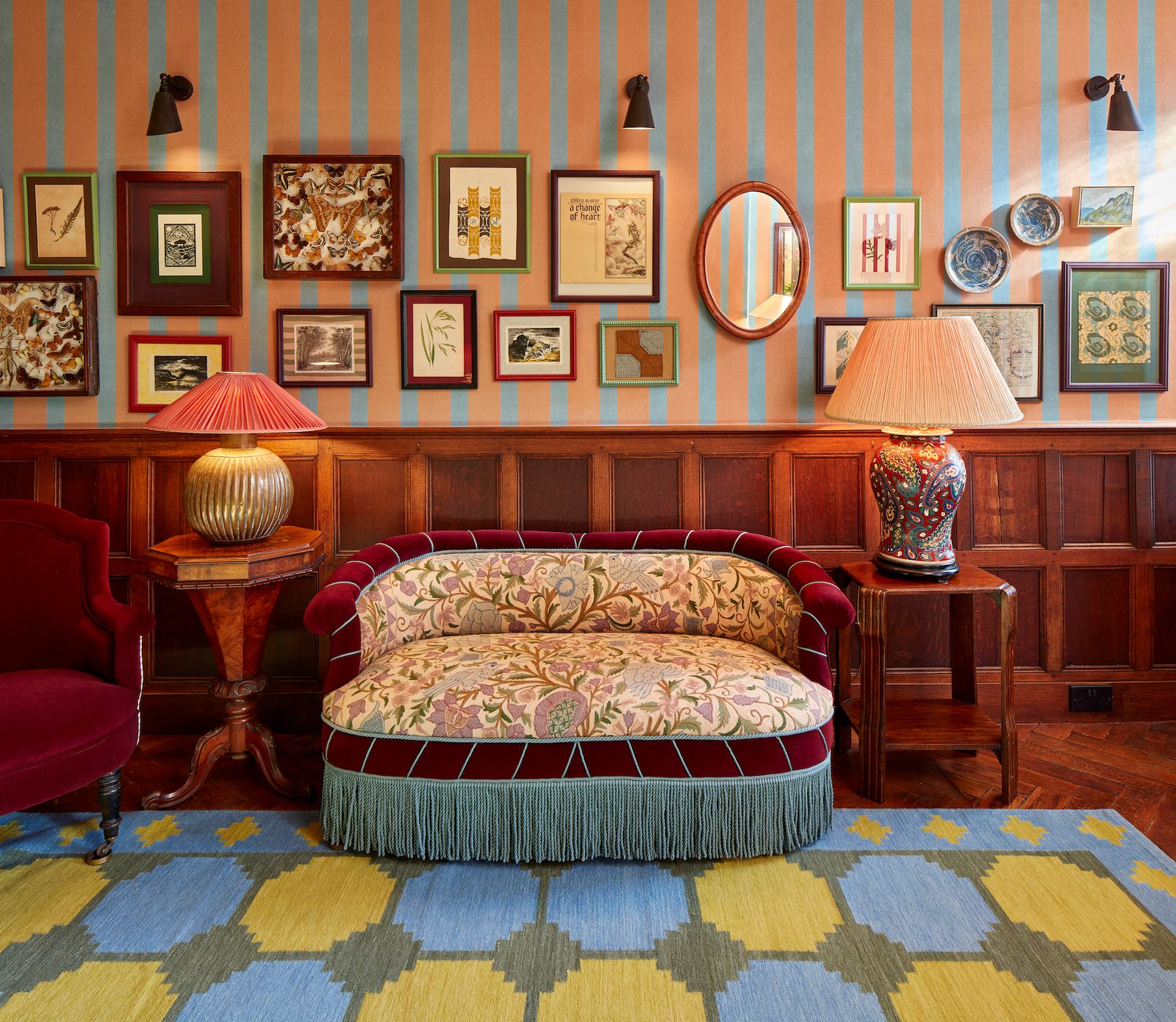 Image may contain Home Decor Lamp Chair Furniture Indoors Interior Design Table Lamp Couch Art Painting and Rug