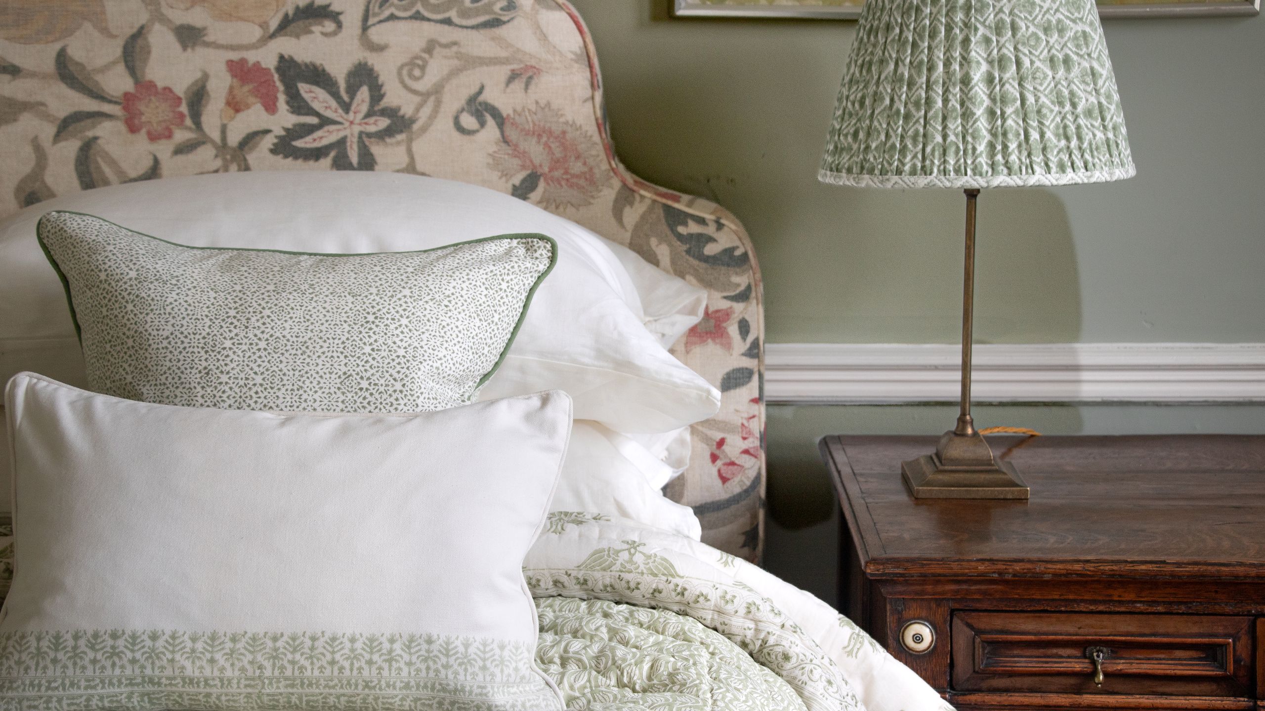 Image may contain: Cushion, Home Decor, Pillow, Lamp, Table Lamp, Bed, and Furniture