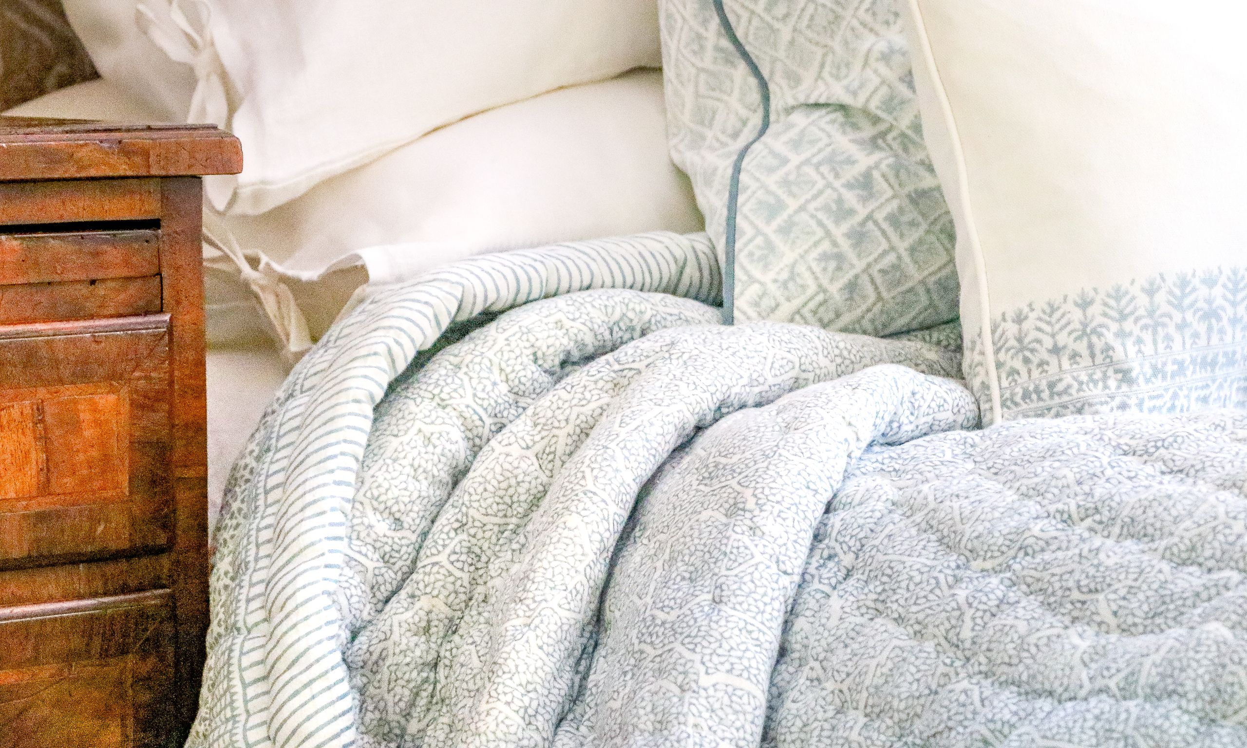 Image may contain: Blanket, Bed, and Furniture