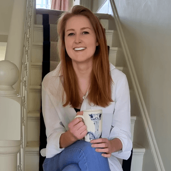 Image may contain: Robin Li, Face, Happy, Head, Person, Smile, Cup, and Laughing