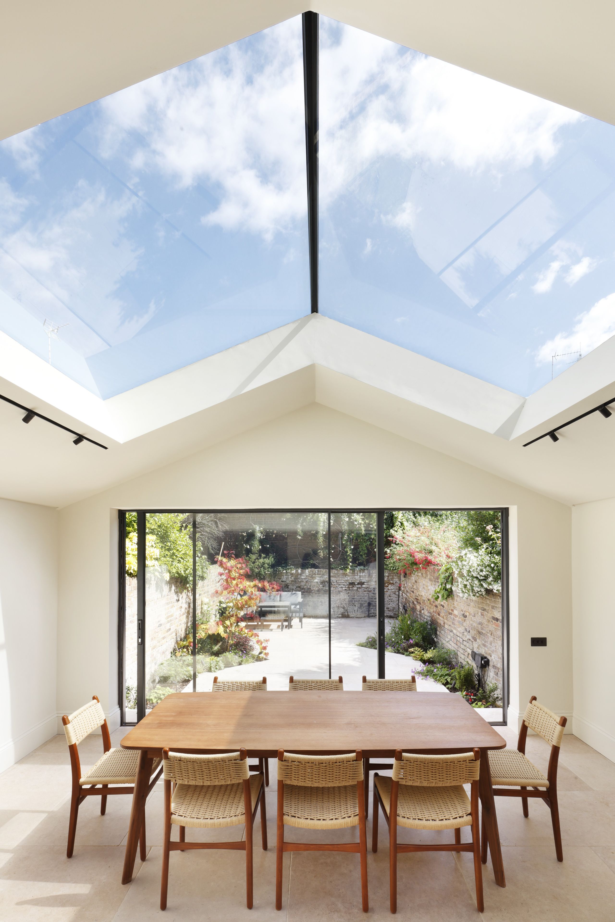 Image may contain: Window, Chair, Furniture, Dining Table, Table, Architecture, Building, Skylight, Dining Room, and Indoors