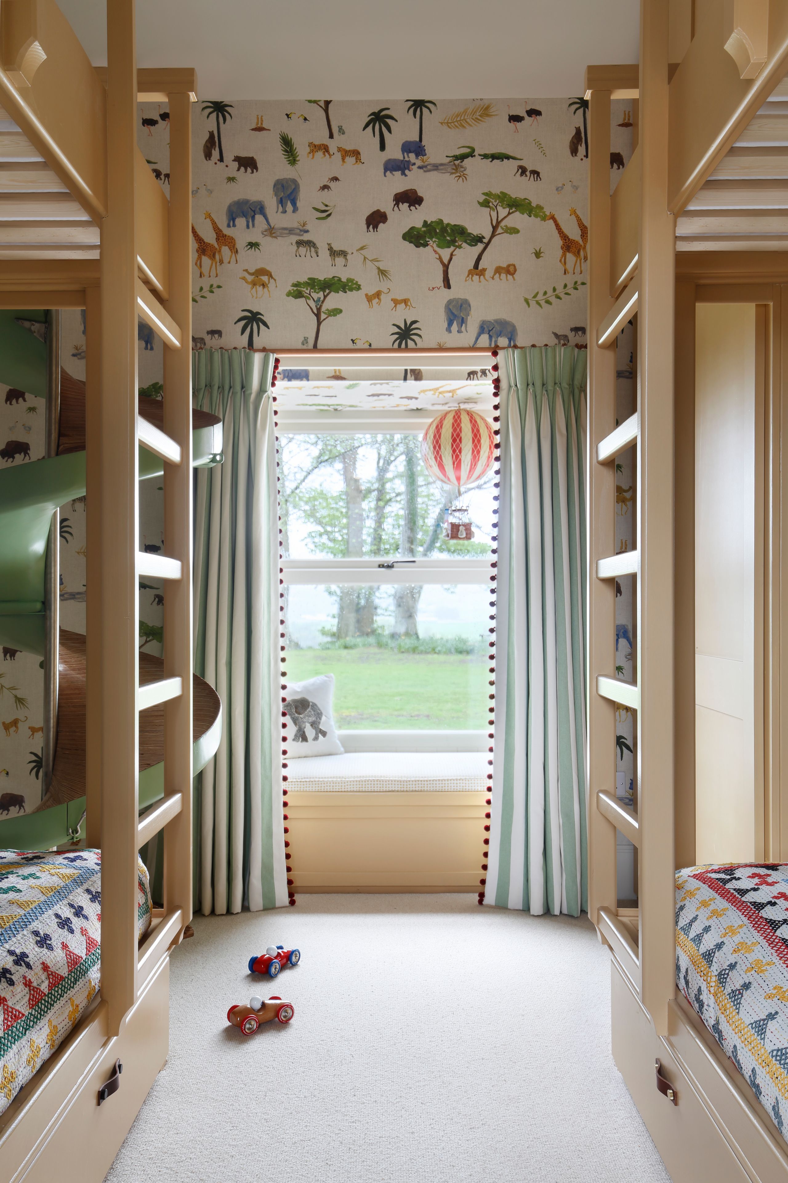 Image may contain: Furniture, Indoors, Bed, Bedroom, Dorm Room, Room, Architecture, Building, Housing, and Car