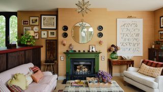 Image may contain Home Decor Couch Furniture Plant Fireplace Indoors Architecture Building Living Room and Room