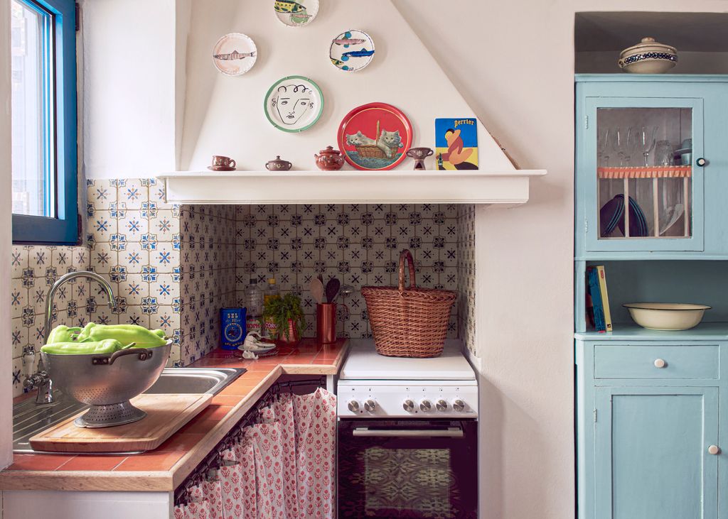 Image may contain Indoors Kitchen Sink Cup Sink Faucet Closet Cupboard Furniture and Plate