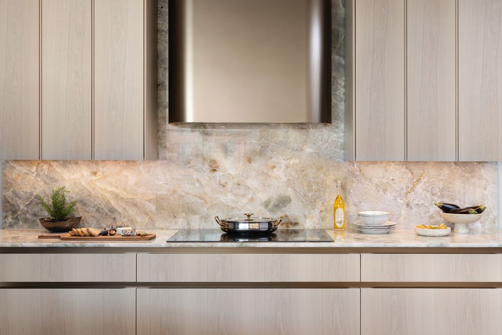 Image may contain Indoors Interior Design Plant Cooktop Kitchen Sink Sink Faucet Window and Windowsill