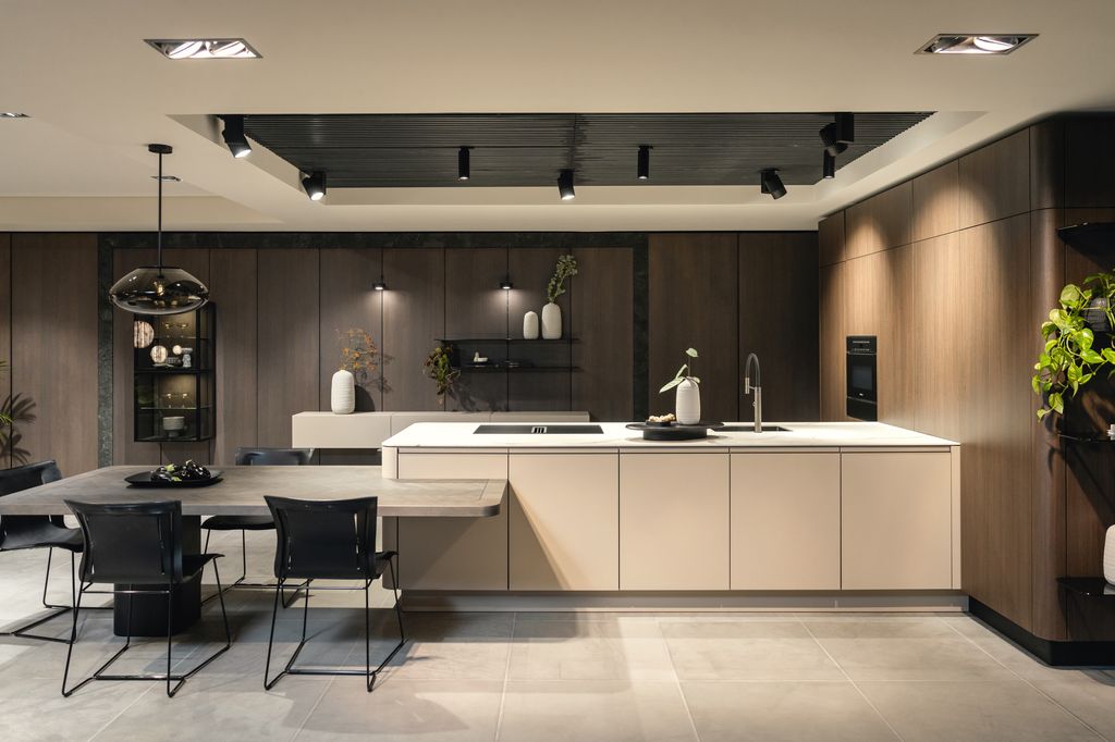 Image may contain Indoors Interior Design Kitchen Chair Furniture Sink Sink Faucet Kitchen Island Lighting and Lamp