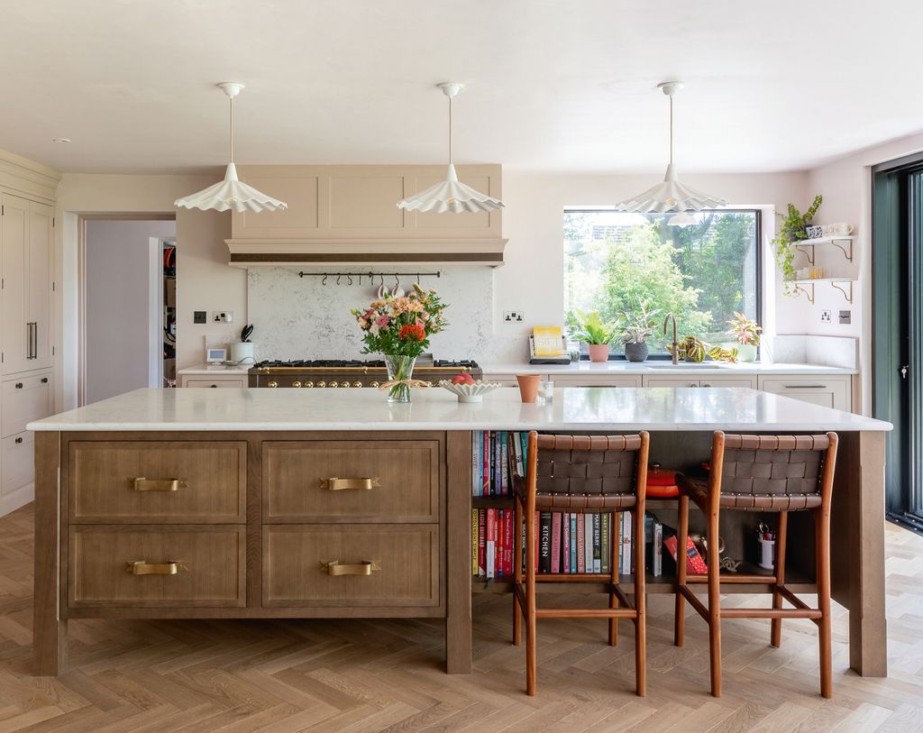 Image may contain Indoors Interior Design Kitchen Kitchen Island Architecture Building Dining Room and Dining Table