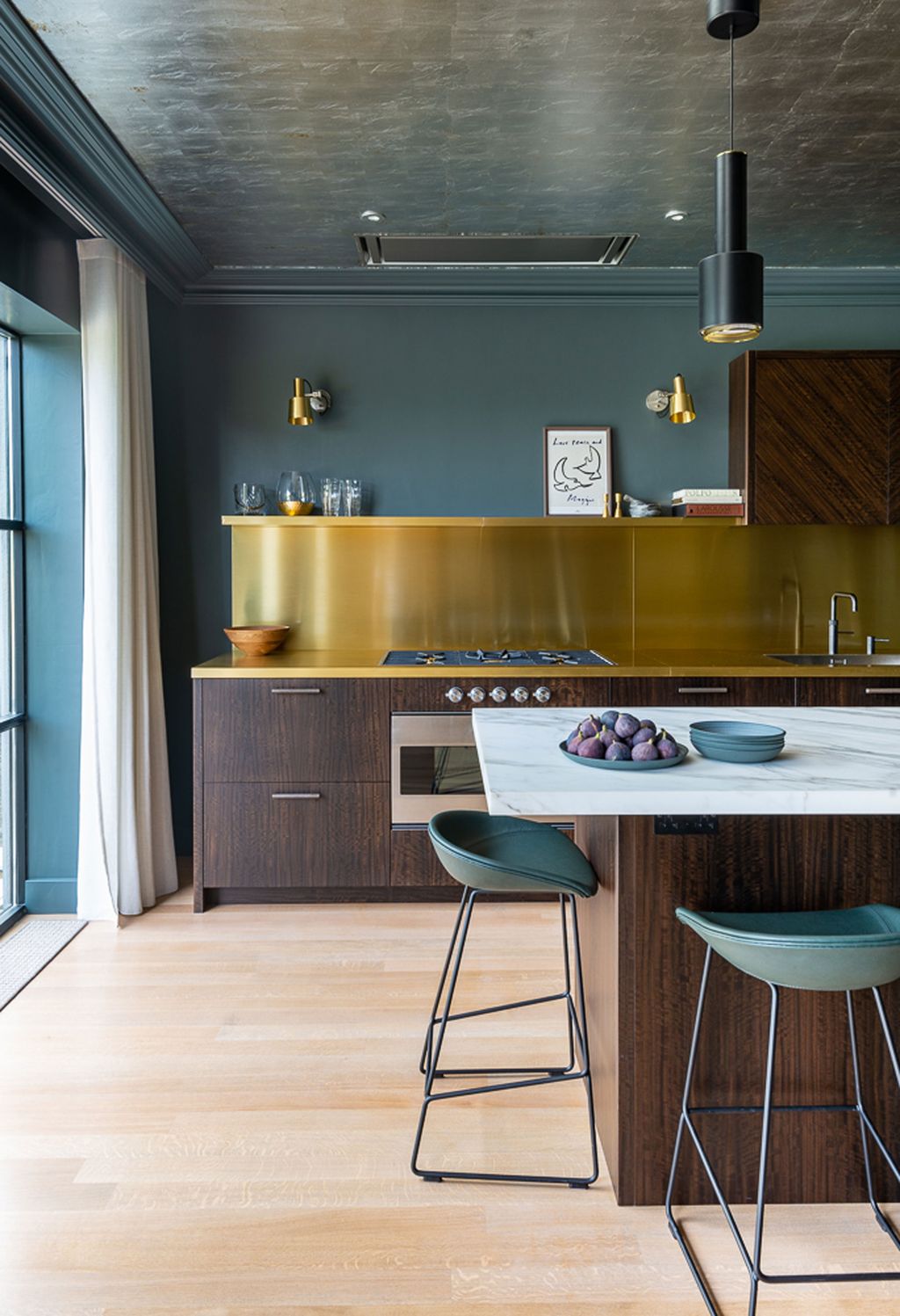 Image may contain Indoors Interior Design Lamp Kitchen Sink Sink Faucet Cooktop Floor Kitchen Island Cup and Chair