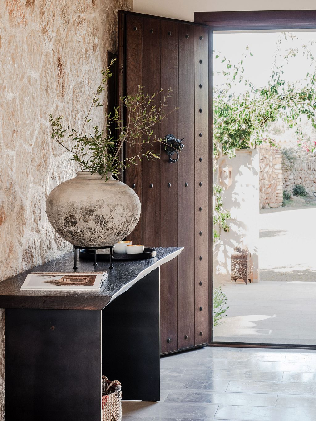 Image may contain Indoors Interior Design Door Plant Desk Furniture Table Architecture Building and Foyer