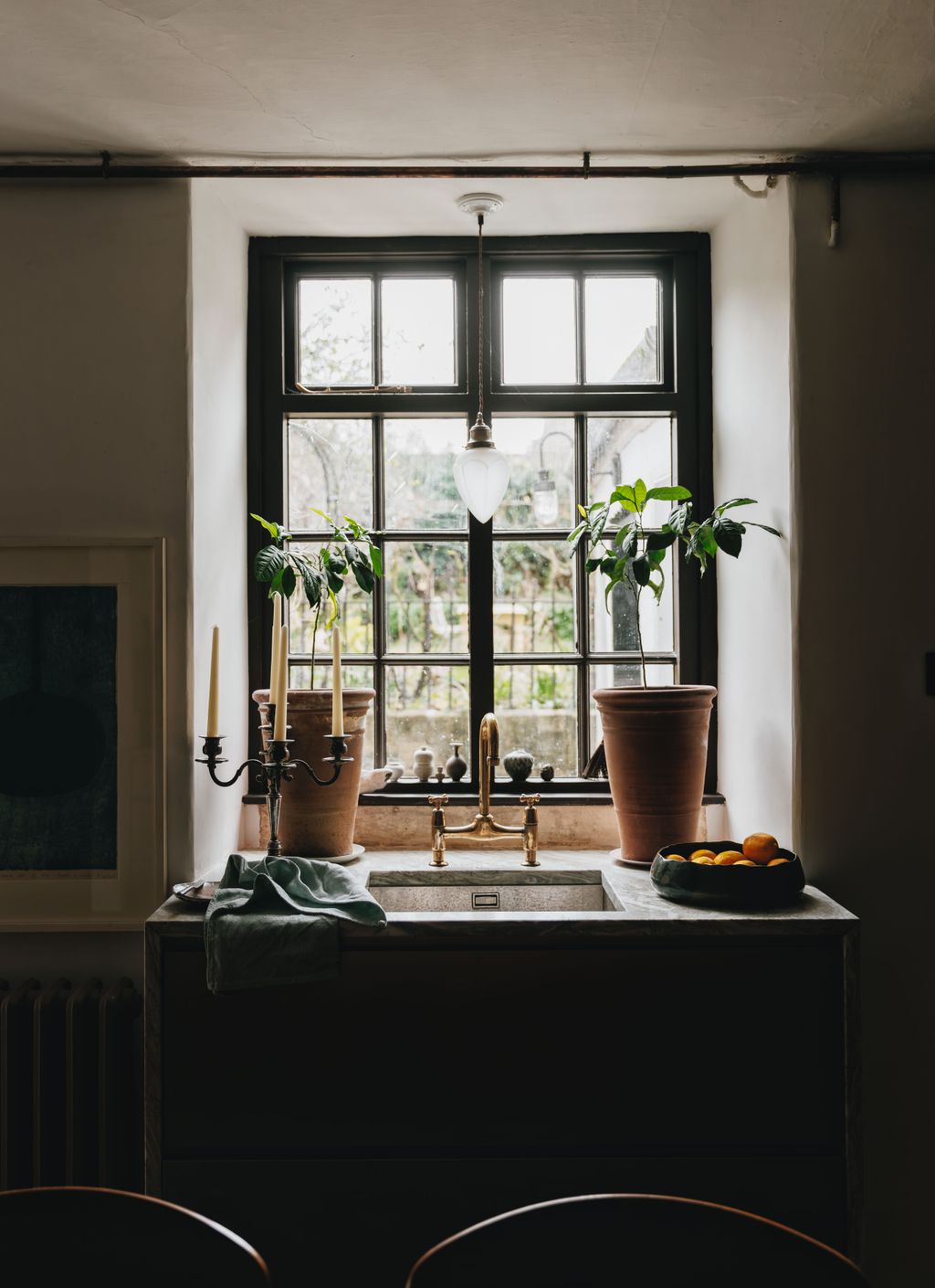 Image may contain Window Lamp Plant Windowsill Sink and Candle