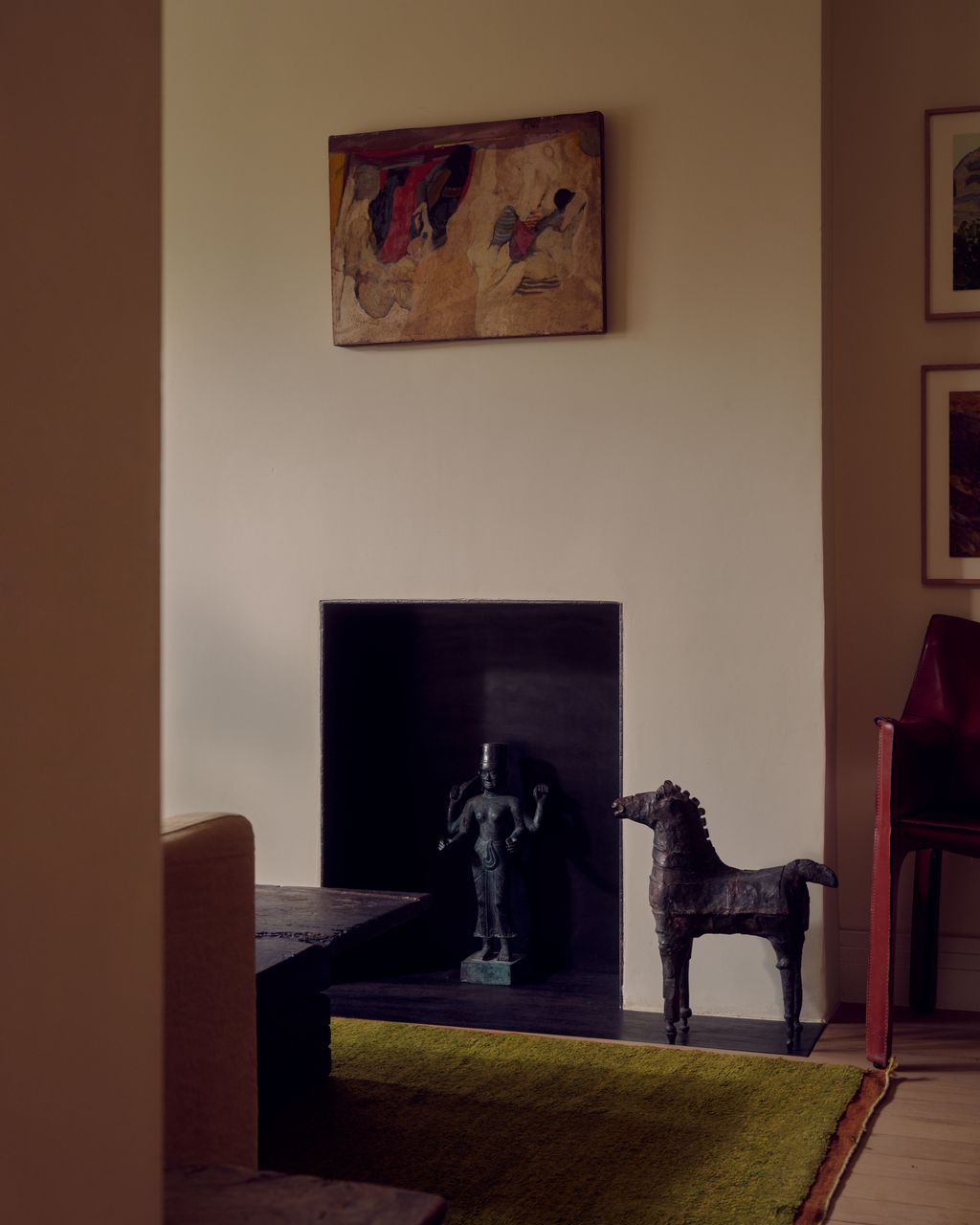 Image may contain Fireplace Indoors Interior Design Art Painting Chair Furniture Home Decor Adult Person and Rug