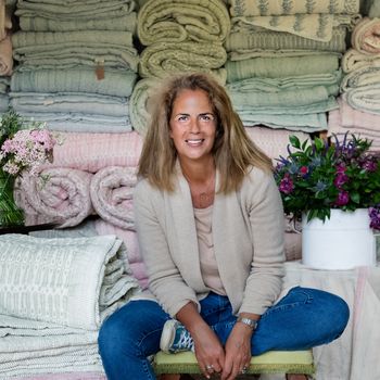 Image may contain: Yasuhisa Furuhara, Clothing, Pants, Face, Head, Person, Photography, Portrait, Adult, Sitting, and Plant