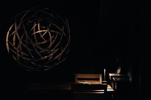 Image may contain Sphere Lighting Lamp Furniture Table Chair and Chandelier