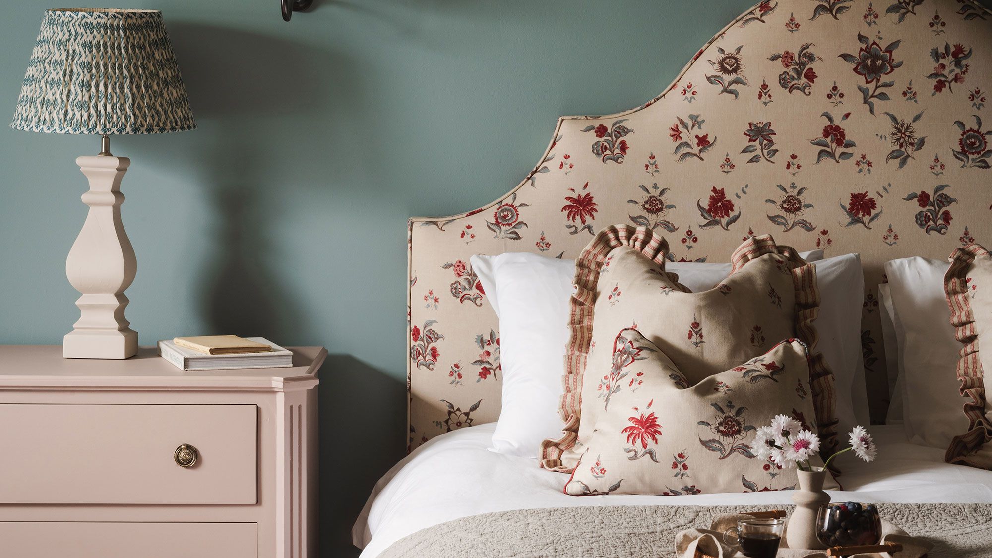 Image may contain: Cushion, Home Decor, Pillow, Lamp, Cup, Bed, and Furniture