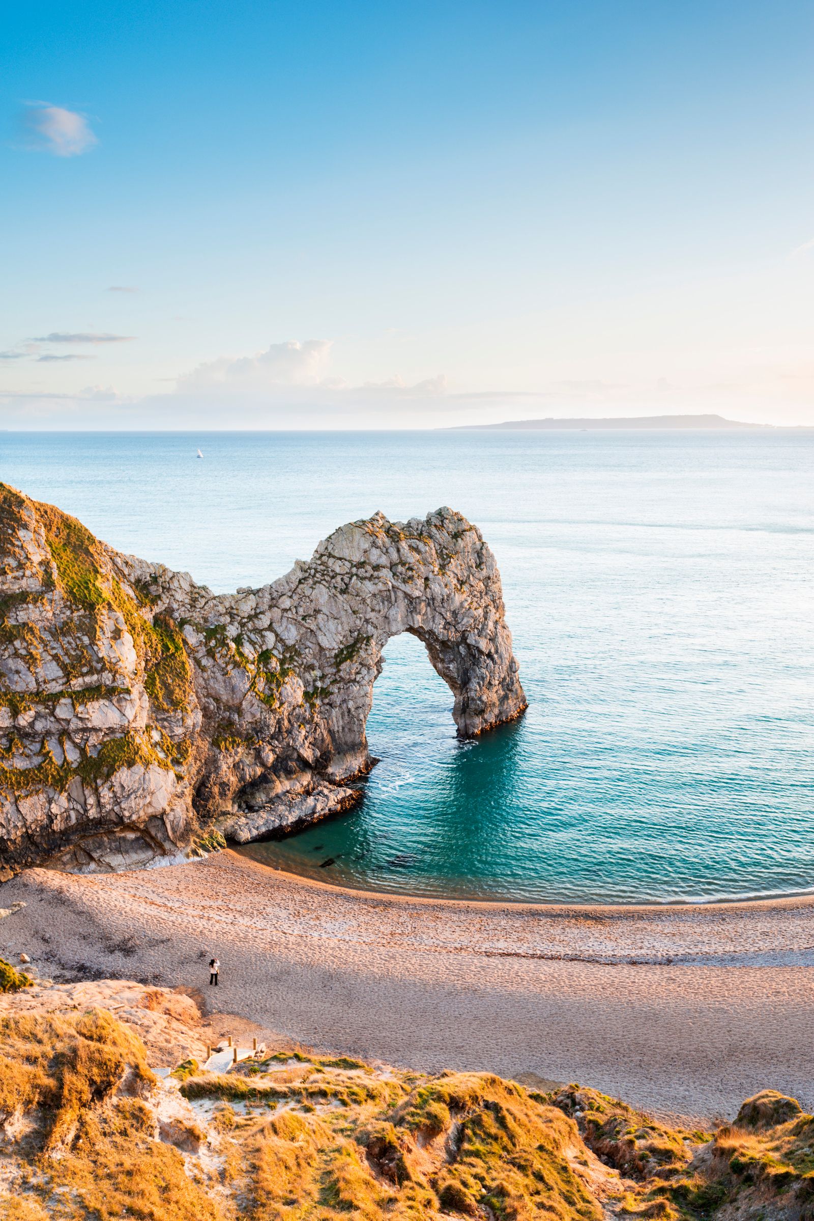 Image may contain Nature Outdoors Sea Water Horizon Sky Coast Shoreline Scenery Person Promontory Rock and Bay