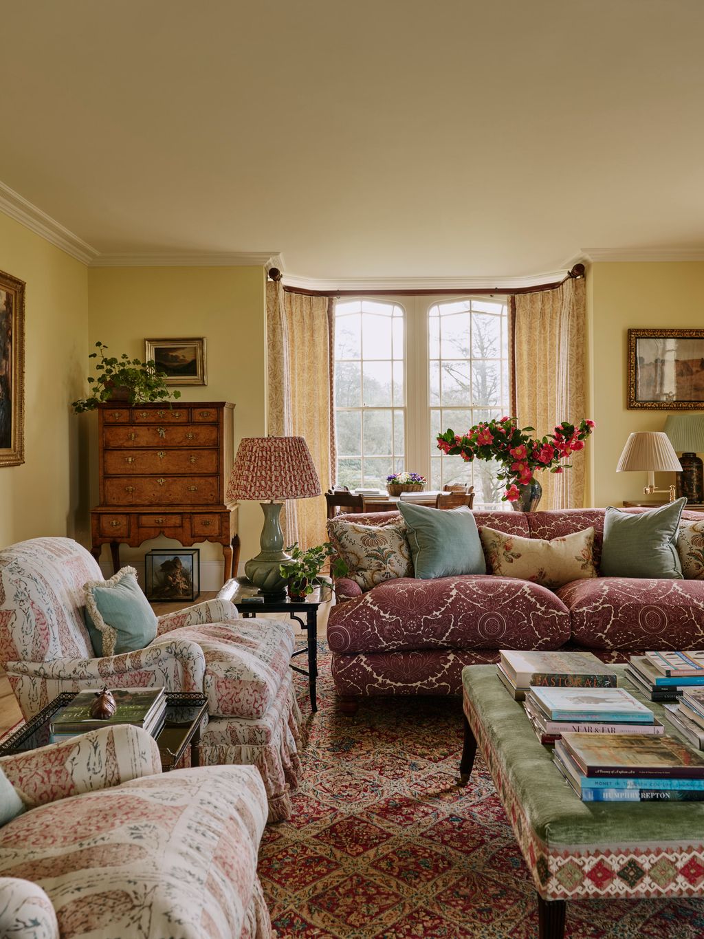 Image may contain Home Decor Lamp Couch Furniture Plant Art Painting Architecture Building Indoors and Living Room