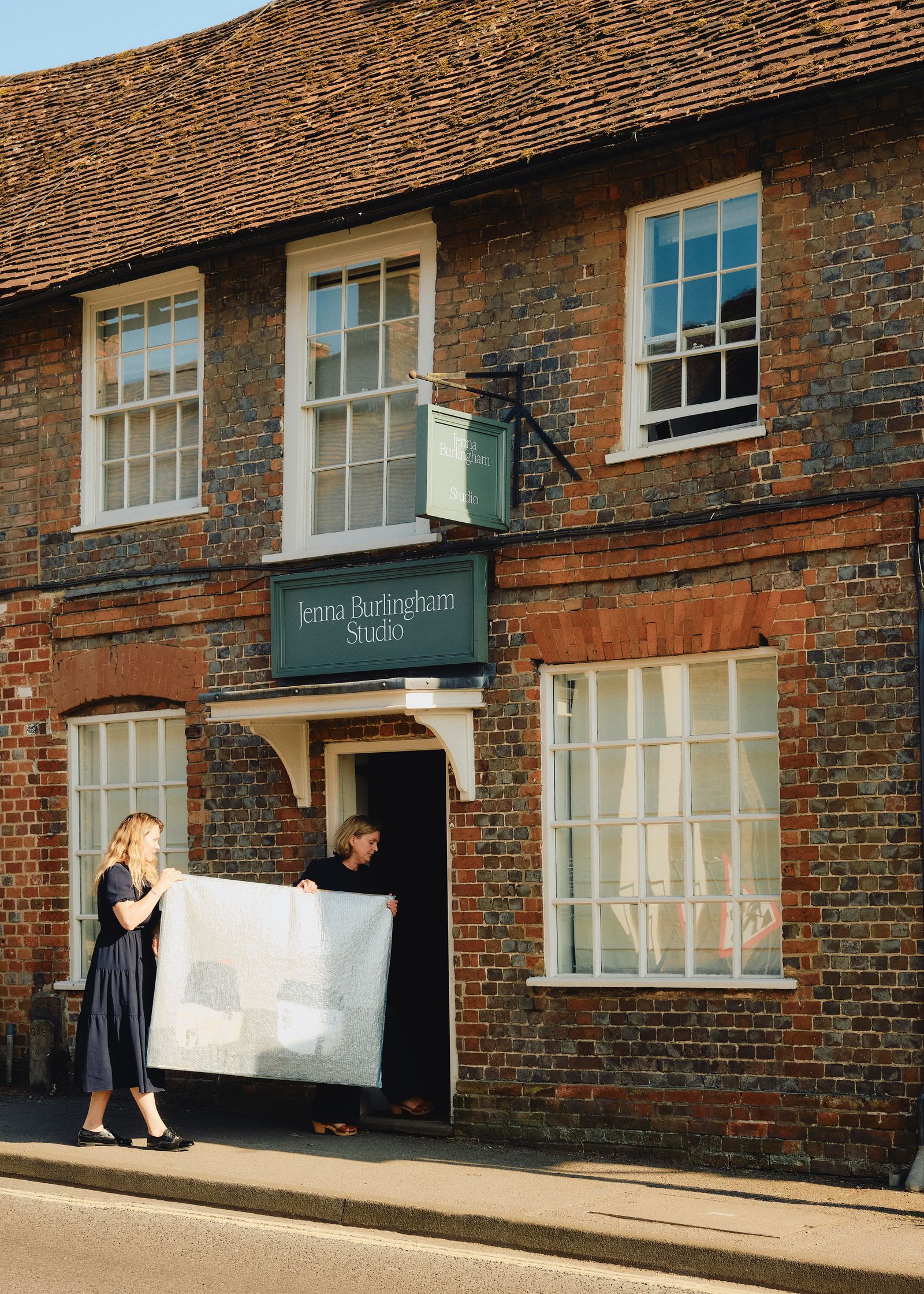 Image may contain January Jones Adult Person Wedding City Clothing Footwear Shoe High Heel and Window