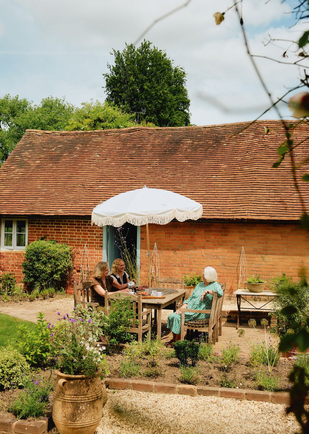 Image may contain Plant Potted Plant Jar Planter Pottery Vase Architecture Building Outdoors Shelter and Backyard
