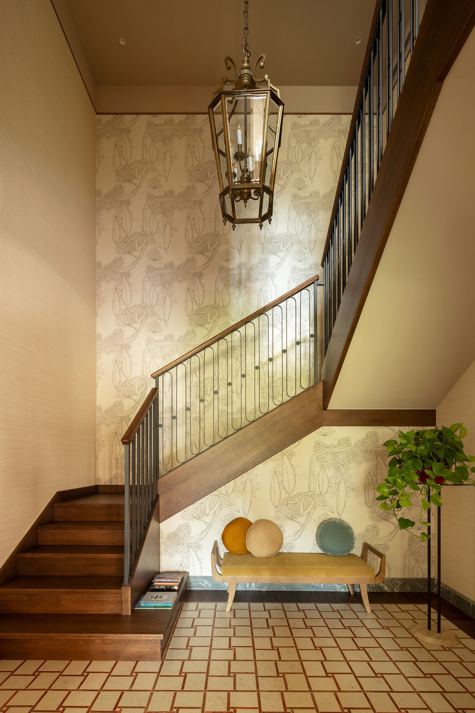 Image may contain Architecture Building Foyer Indoors Lamp Plant Floor House Housing Staircase and Furniture