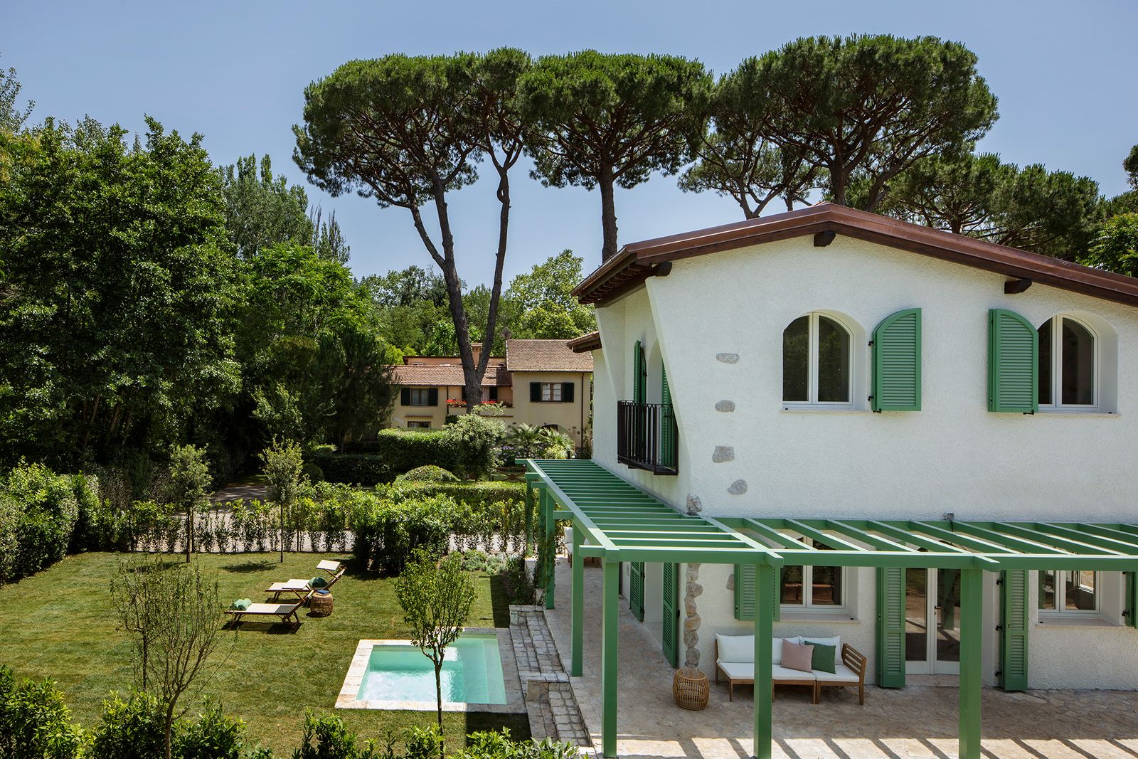 Image may contain Architecture Building House Housing Villa Hotel Resort Bench Furniture and Chair