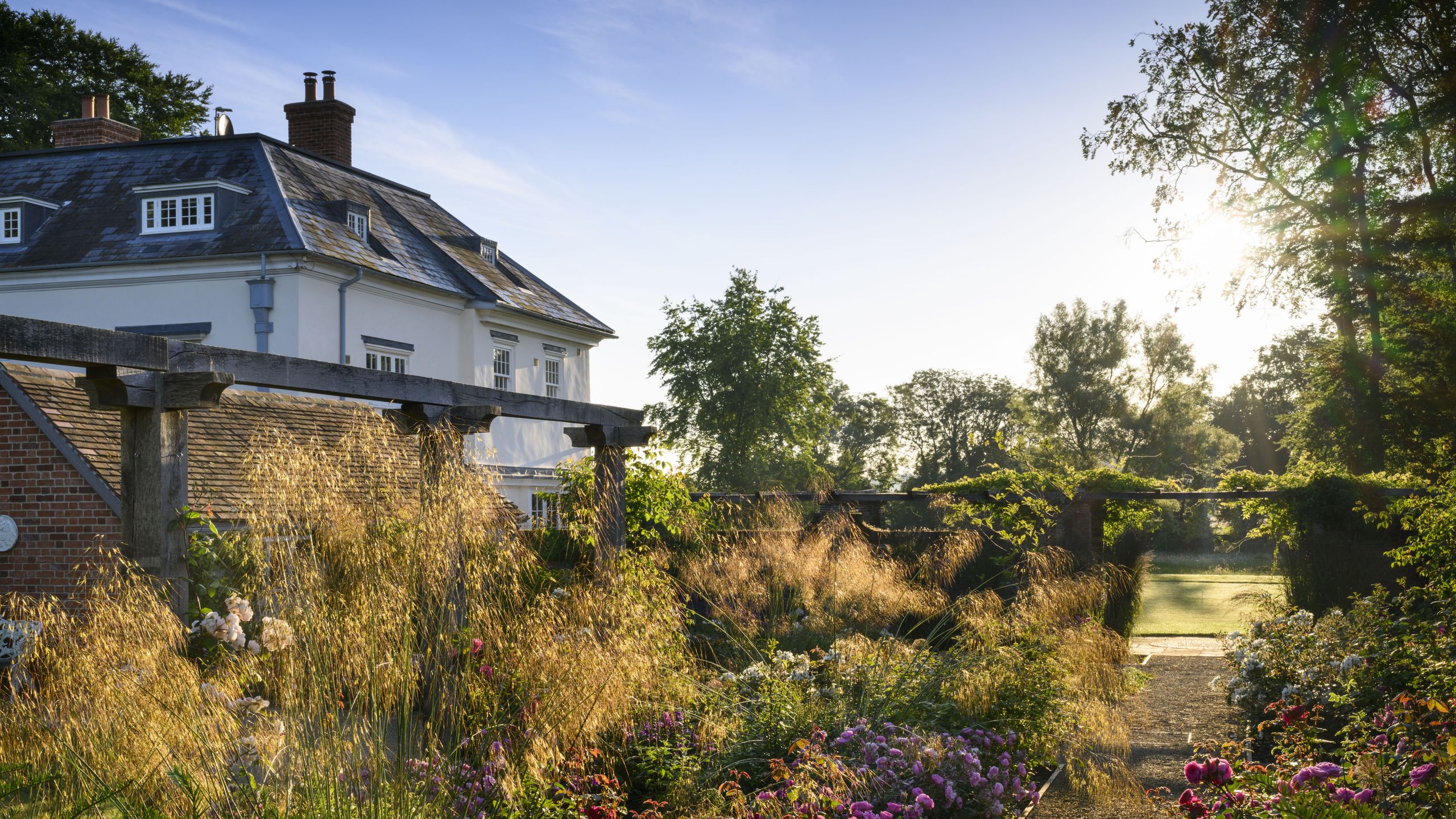 Image may contain: Architecture, Building, Cottage, House, Housing, Garden, Nature, Outdoors, Grass, Plant, and Vegetation