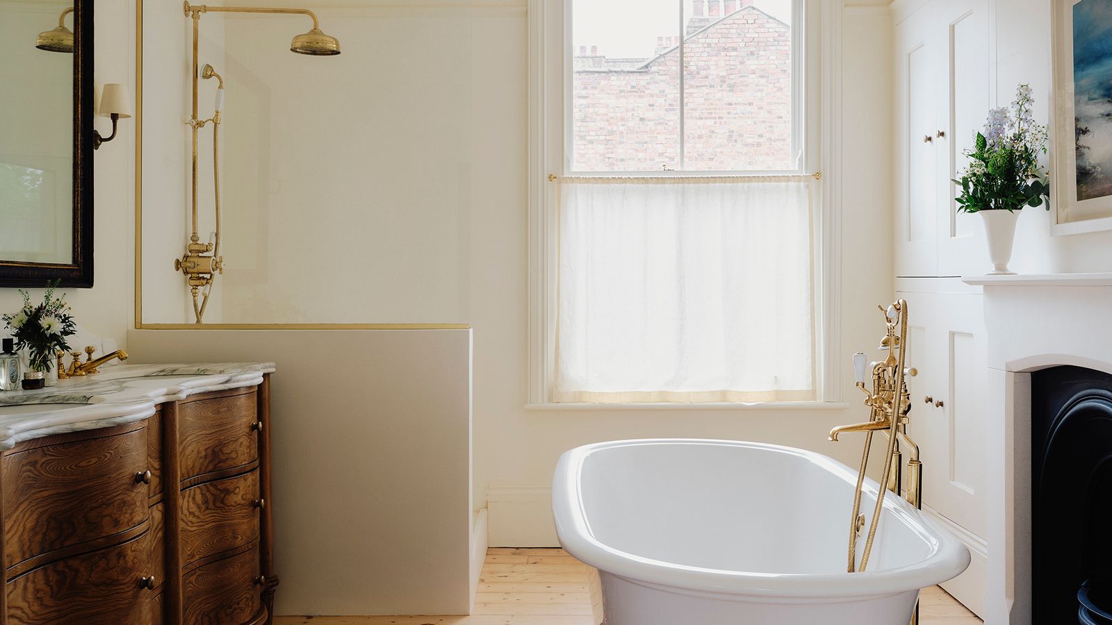 Image may contain: Bathing, Home Decor, Bathtub, Person, Tub, Rug, Lamp, Plant, Indoors, Interior Design, Art, and Painting