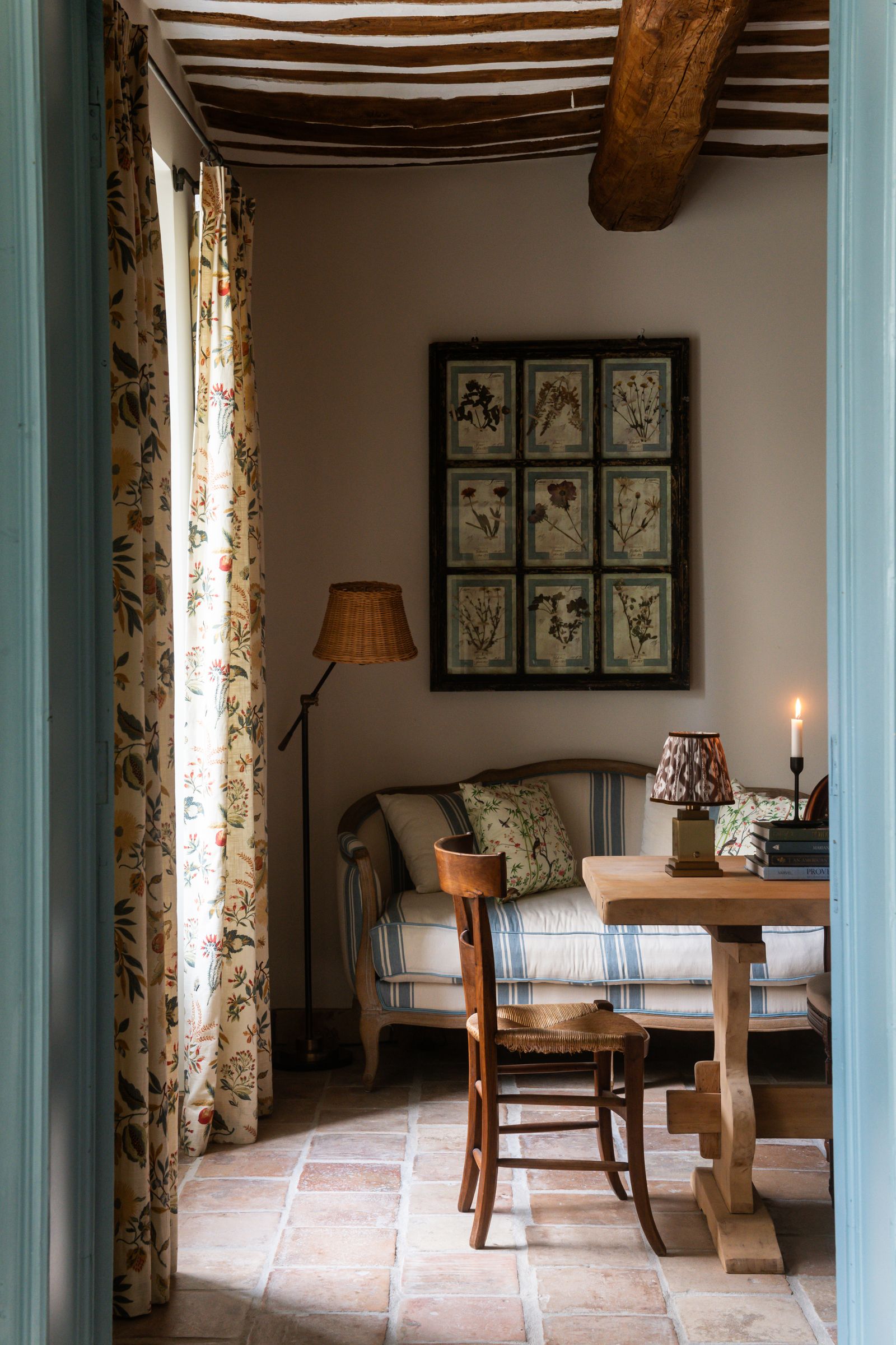 Image may contain Lamp Floor Home Decor Indoors Interior Design Chair Furniture Table Desk Candle and Couch