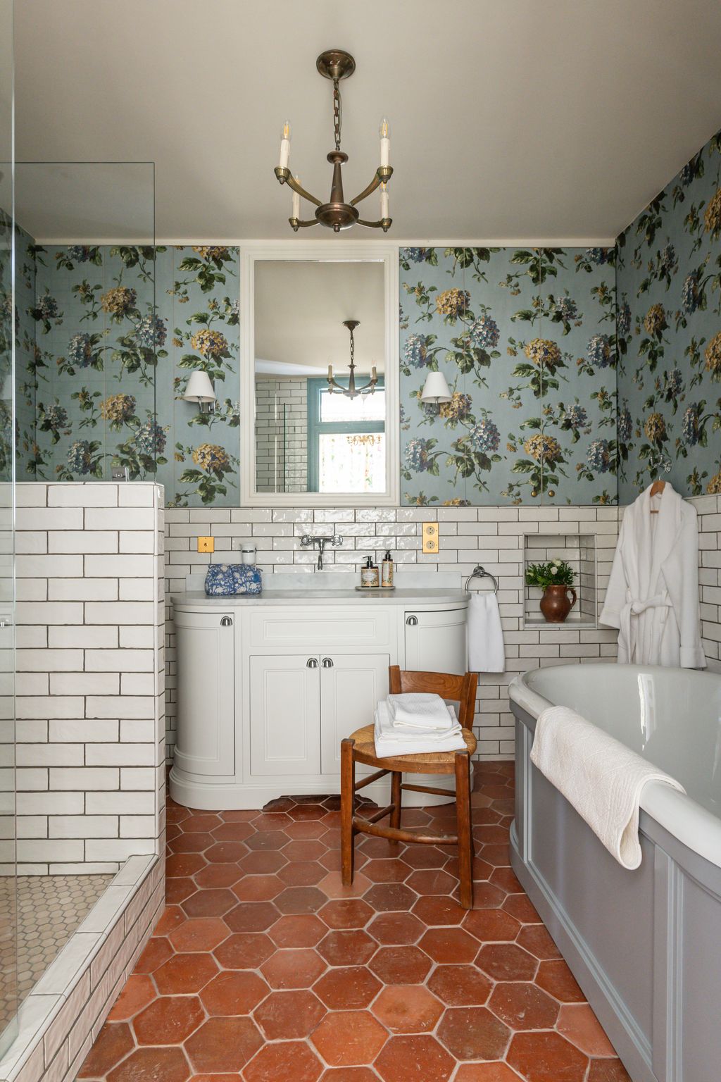 Image may contain Floor Lamp Flooring Chair Furniture Indoors Interior Design Plant Chandelier Bathing and Bathtub