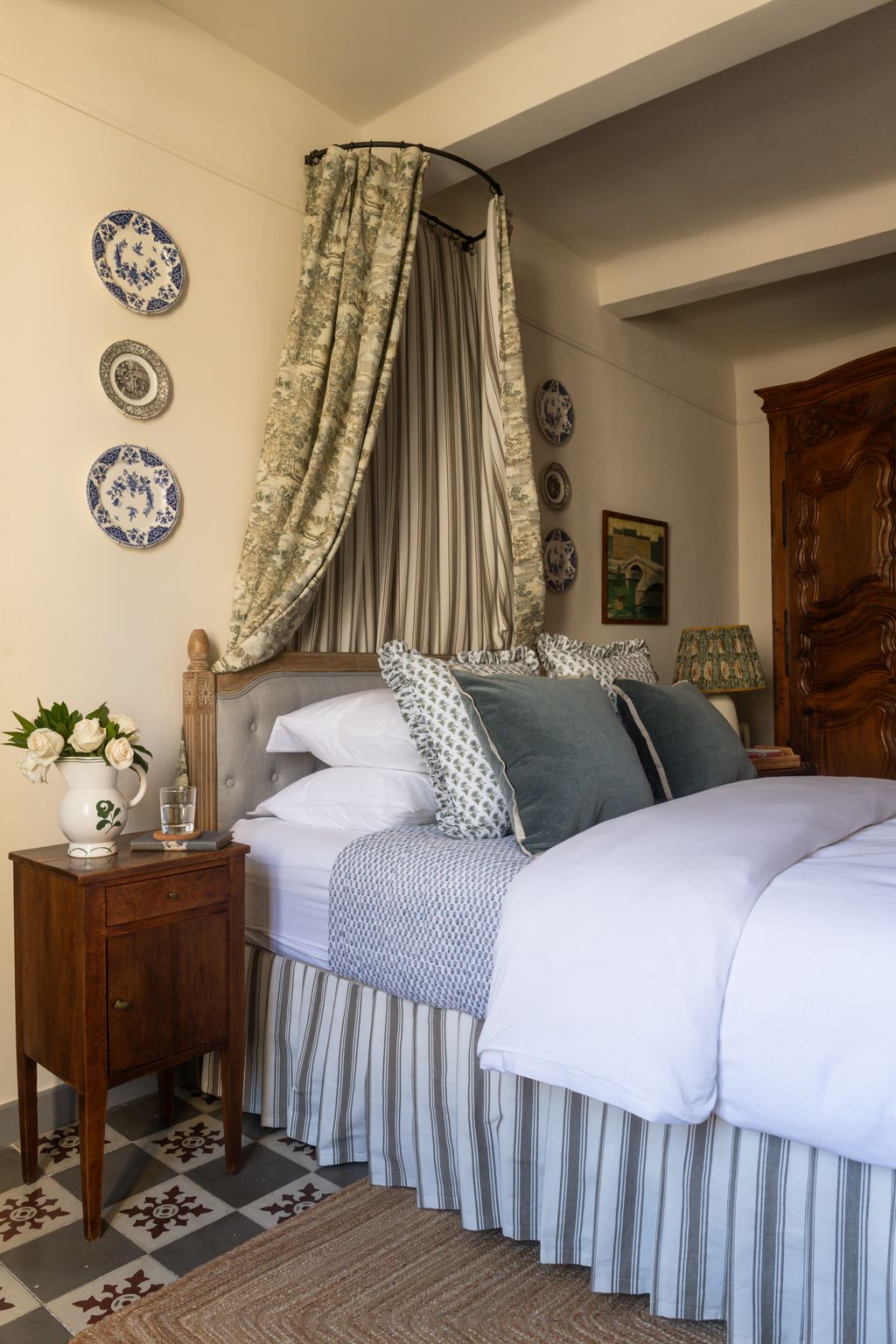 Image may contain Lamp Cushion Home Decor Indoors Interior Design Furniture Book Publication Bed Art and Painting