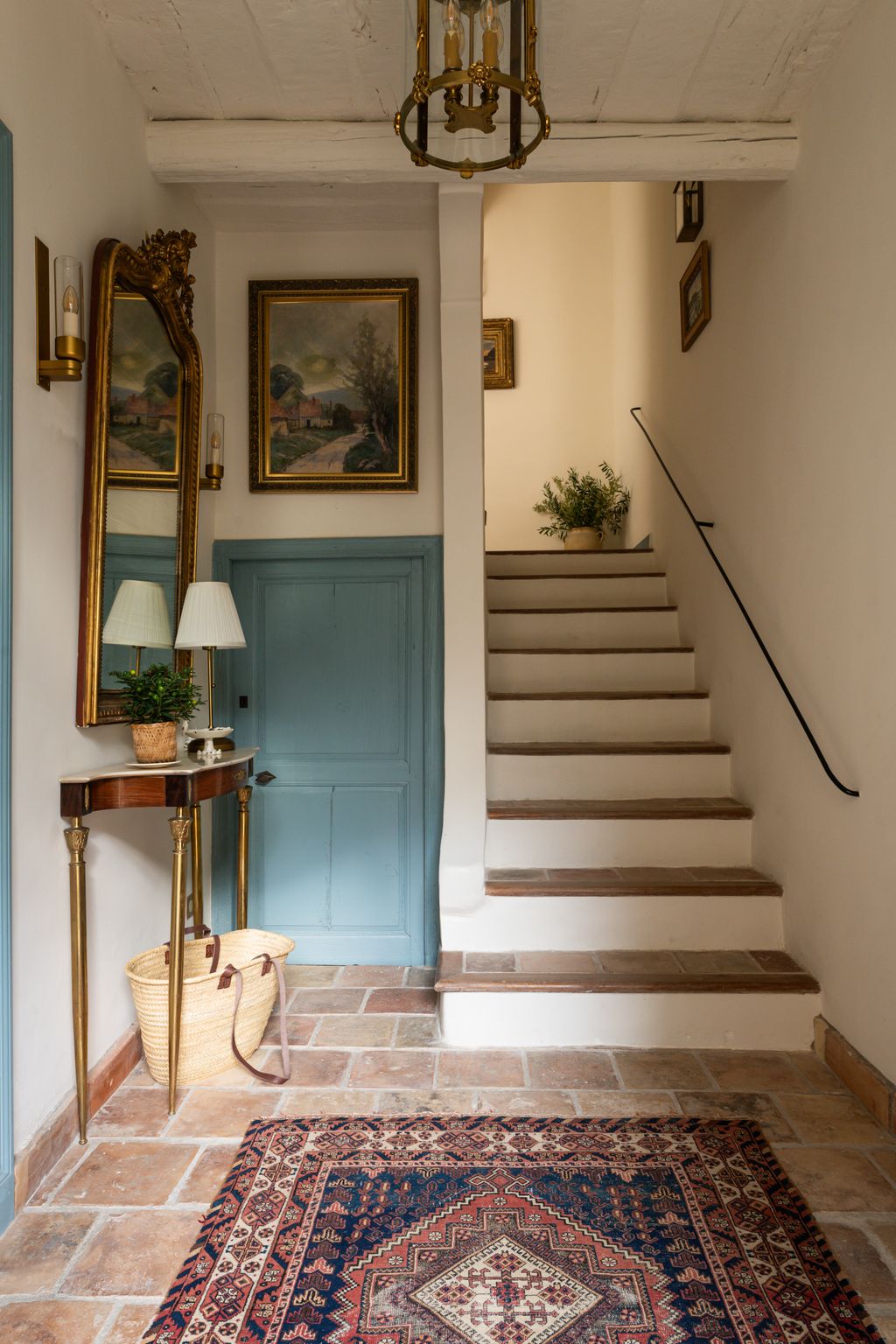 Image may contain Plant Lamp Home Decor Rug Architecture Building Foyer Indoors Art Painting House and Housing