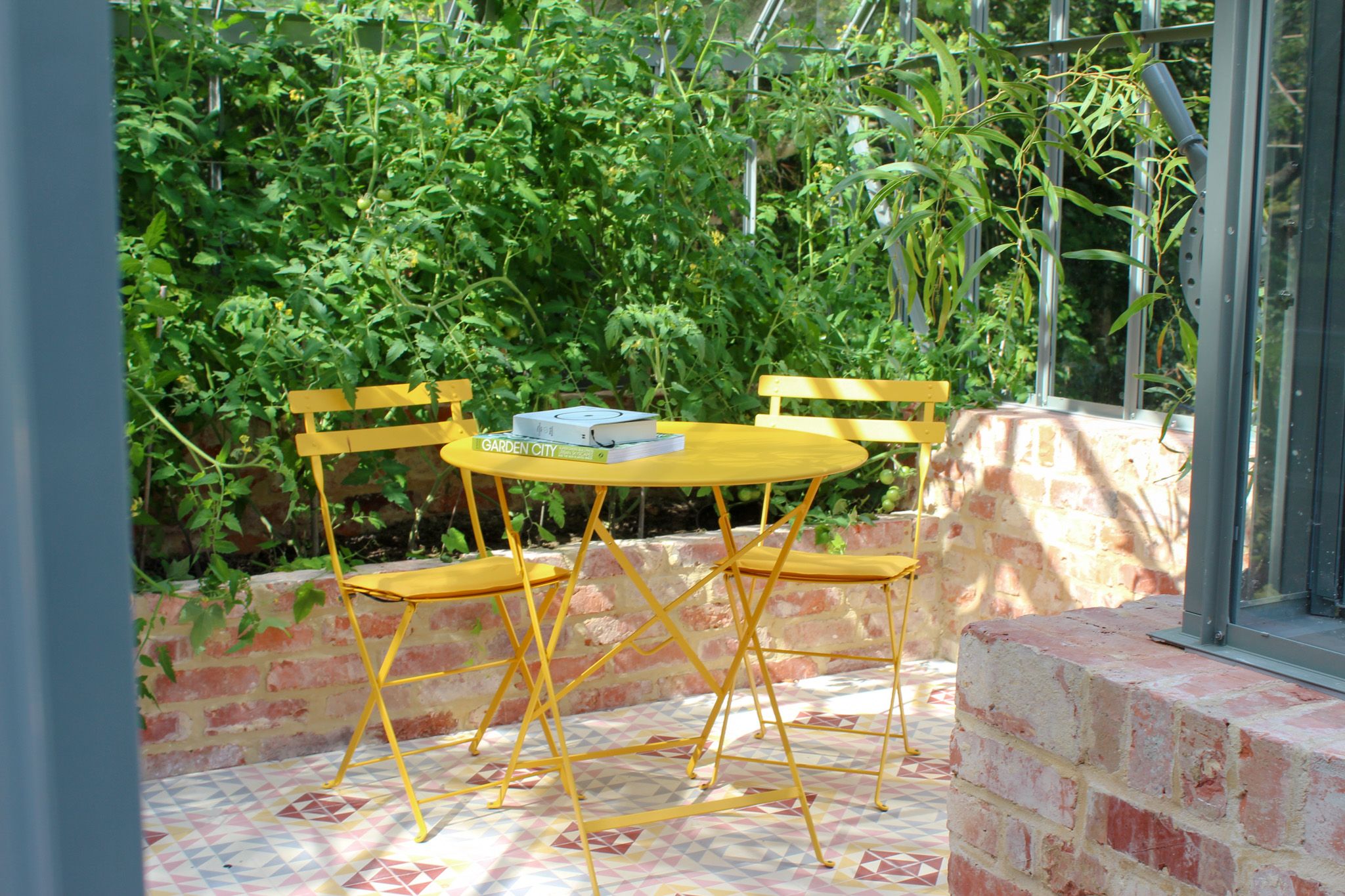 Image may contain: Chair, Furniture, Desk, Table, Indoors, Interior Design, Dining Table, Architecture, Balcony, and Building