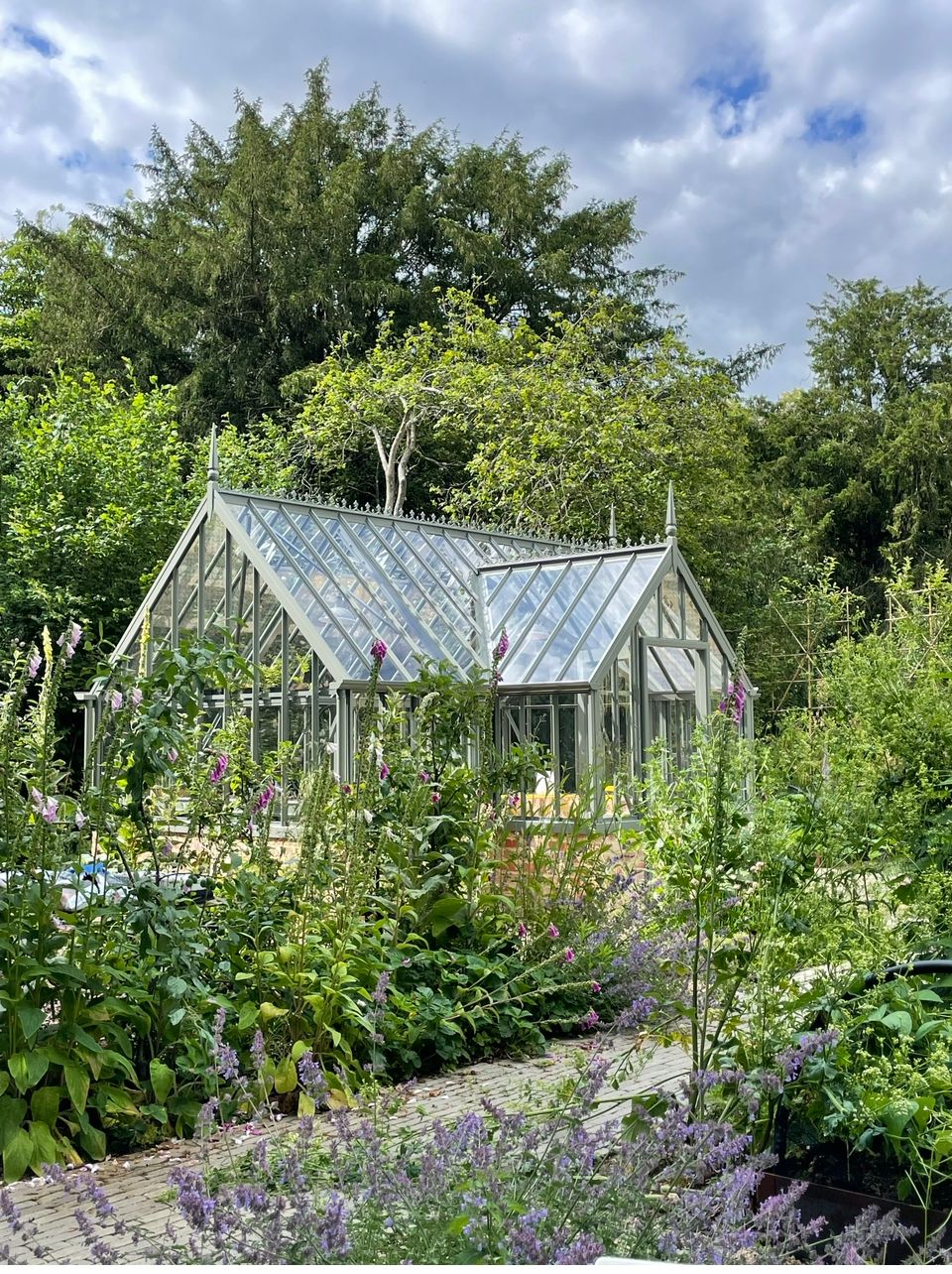 Image may contain: Garden, Nature, Outdoors, Gardening, Greenhouse, Plant, and Vegetation