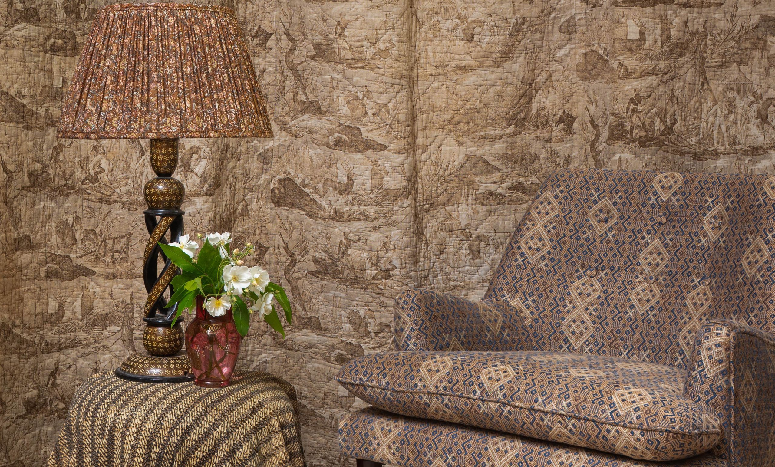 Image may contain: Lamp, Couch, Furniture, Home Decor, and Table Lamp