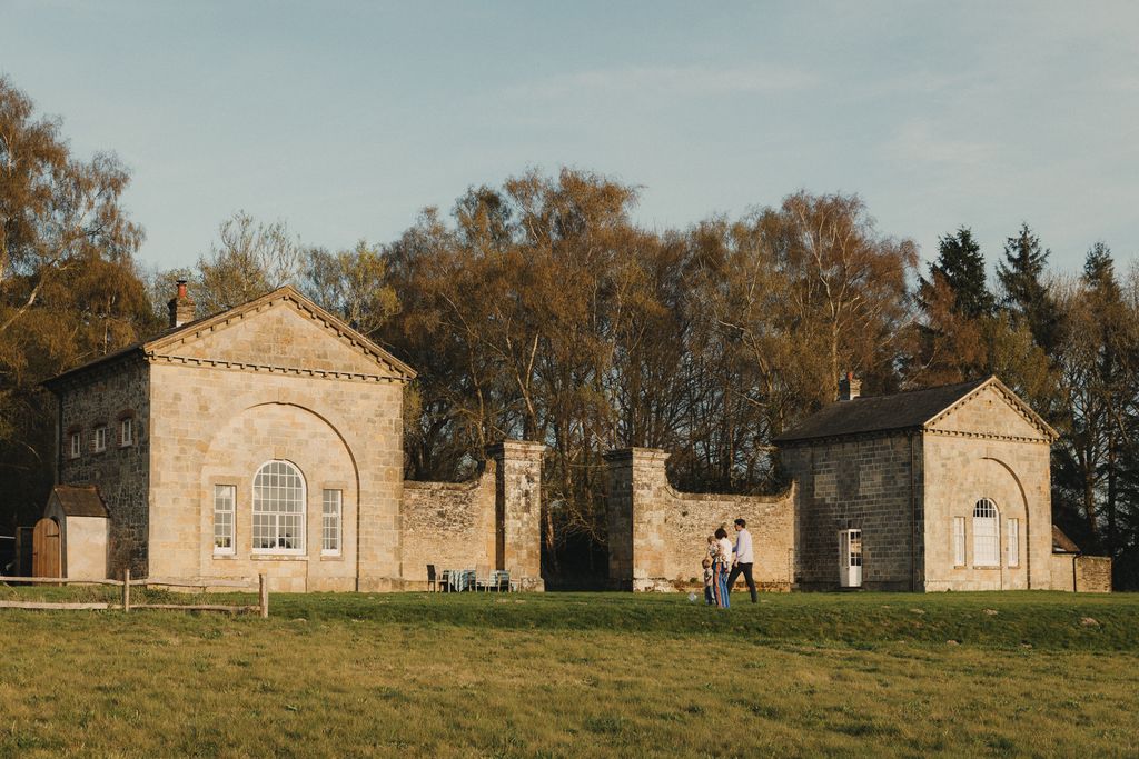 Image may contain Grass Plant Architecture Building Monastery Person Lawn Housing Cottage House Outdoors and Arch